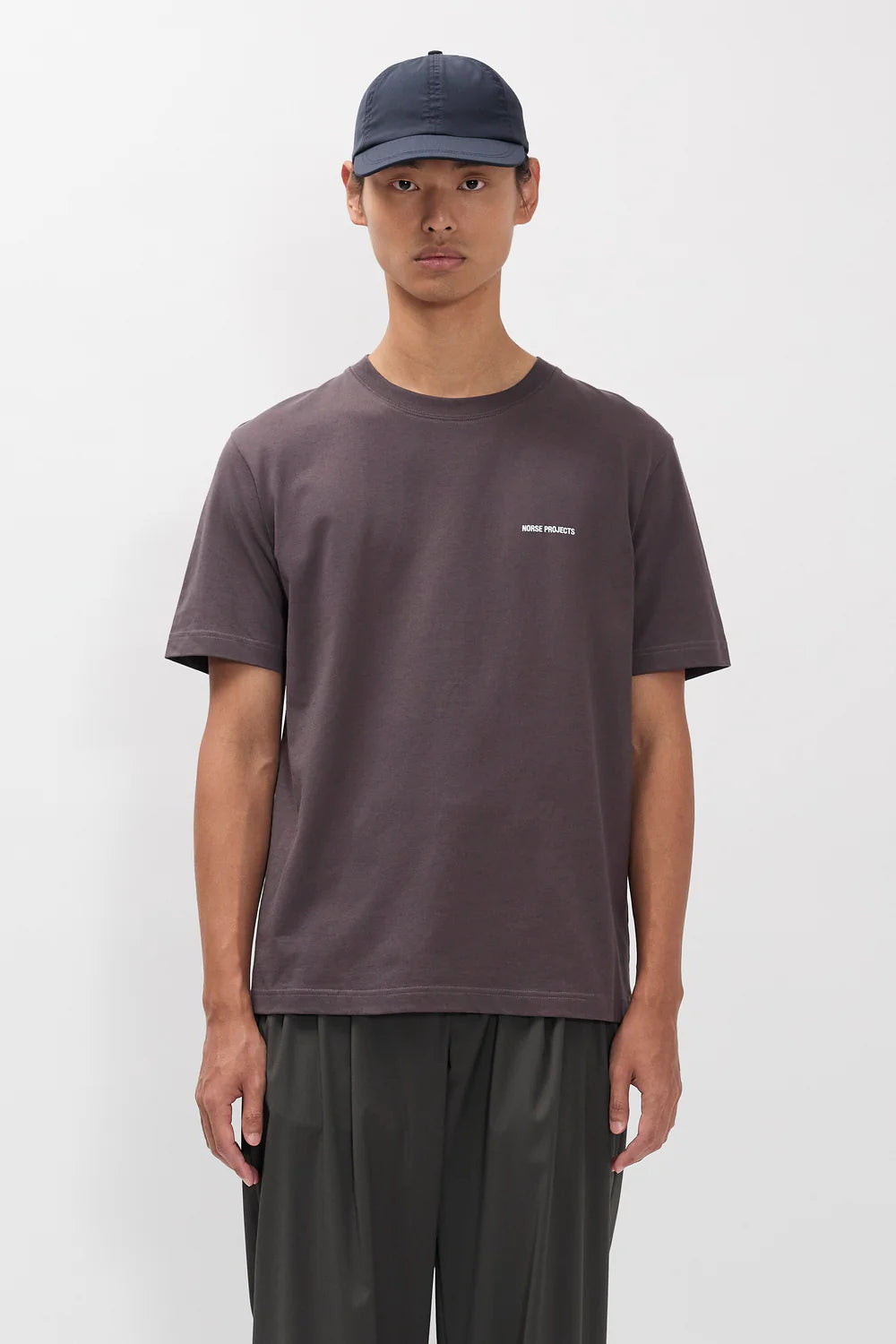 Model wearing Norse Projects Dyrehaven organic logo print t-shirt shale
