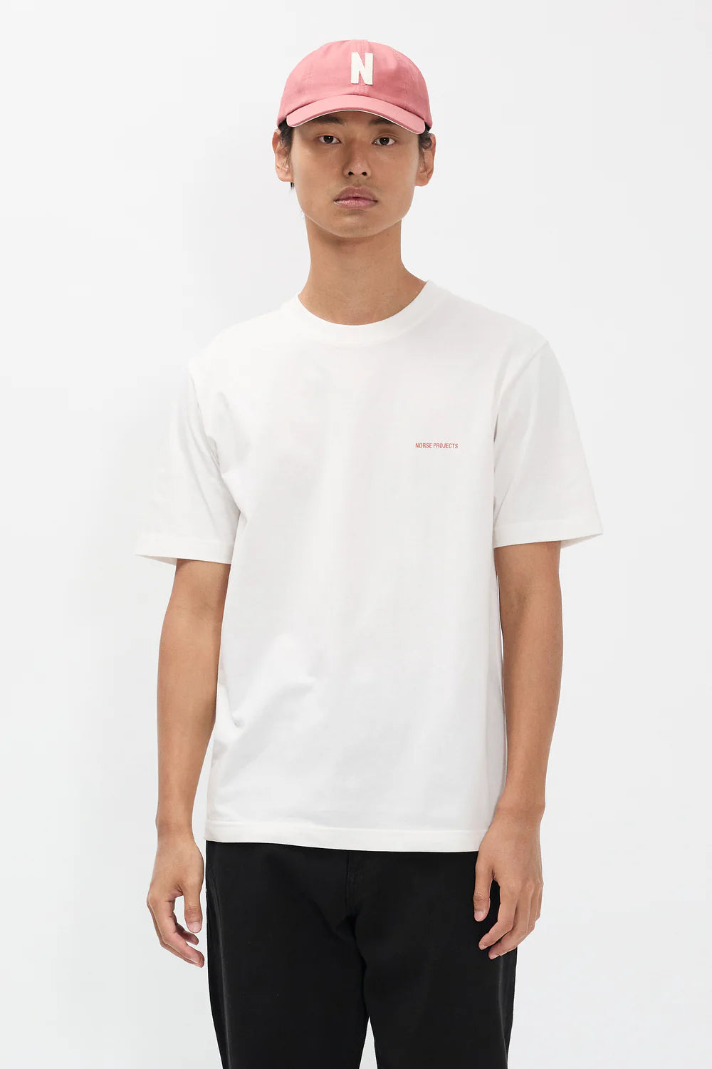 Model wearing Norse Projects Dyrehaven organic logo print t-shirt white