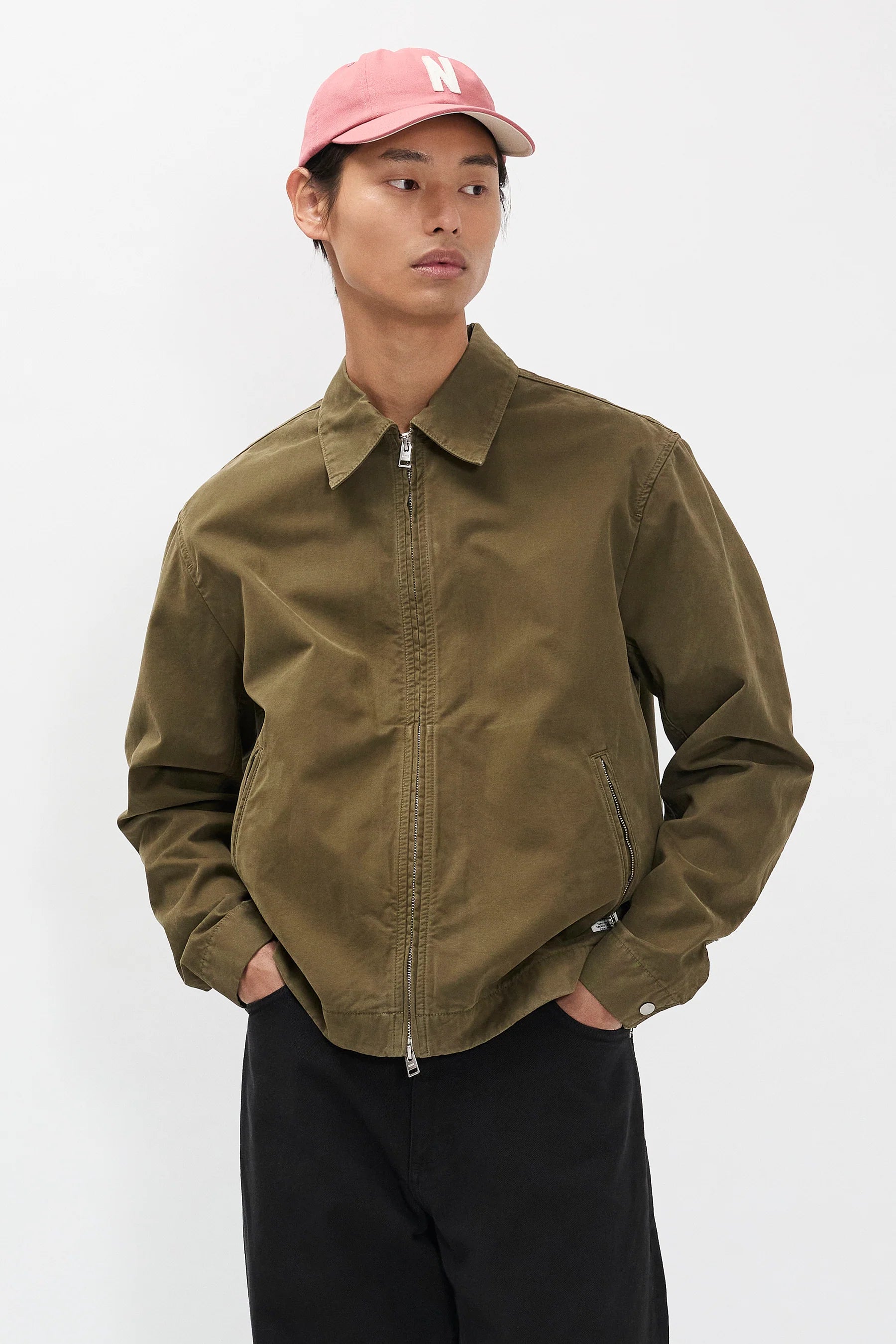 Model wearing Norse Projects Raabjerg canvas jacket olive night relaxed fit