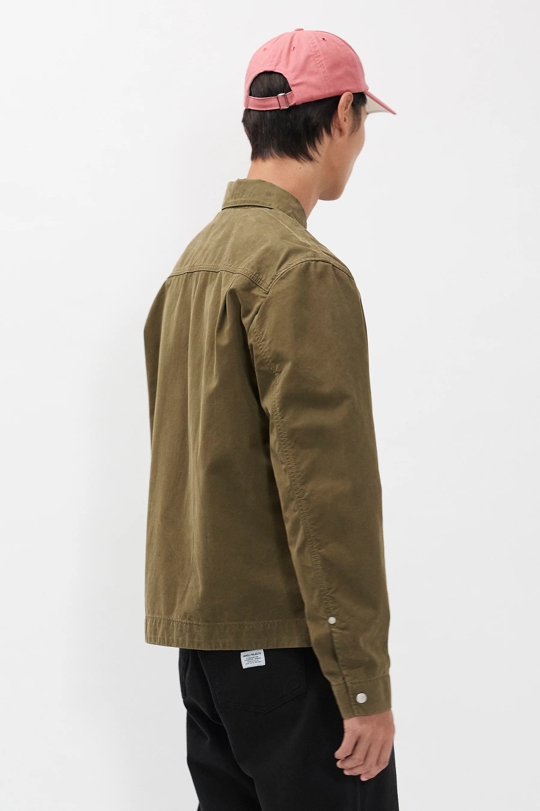 Side view Norse Projects Raabjerg canvas jacket olive night on model