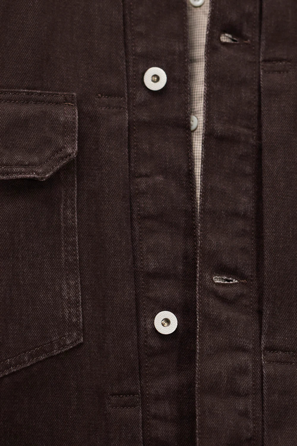 Detail of resist dyed twill fabric Norse Projects jacket shale texture
