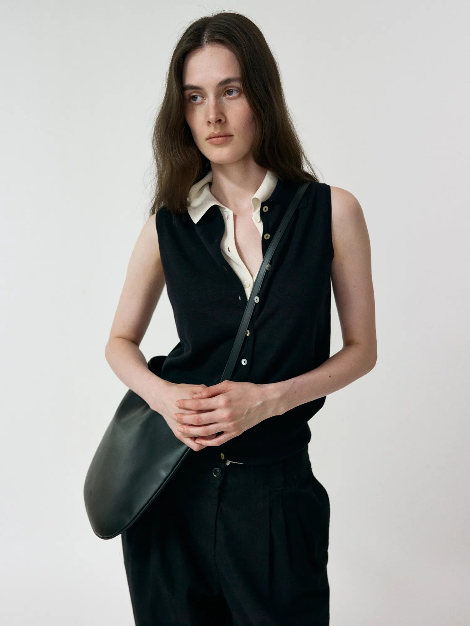 Model wearing NOTHING WRITTEN Lash Sleeveless Knit Top in Black