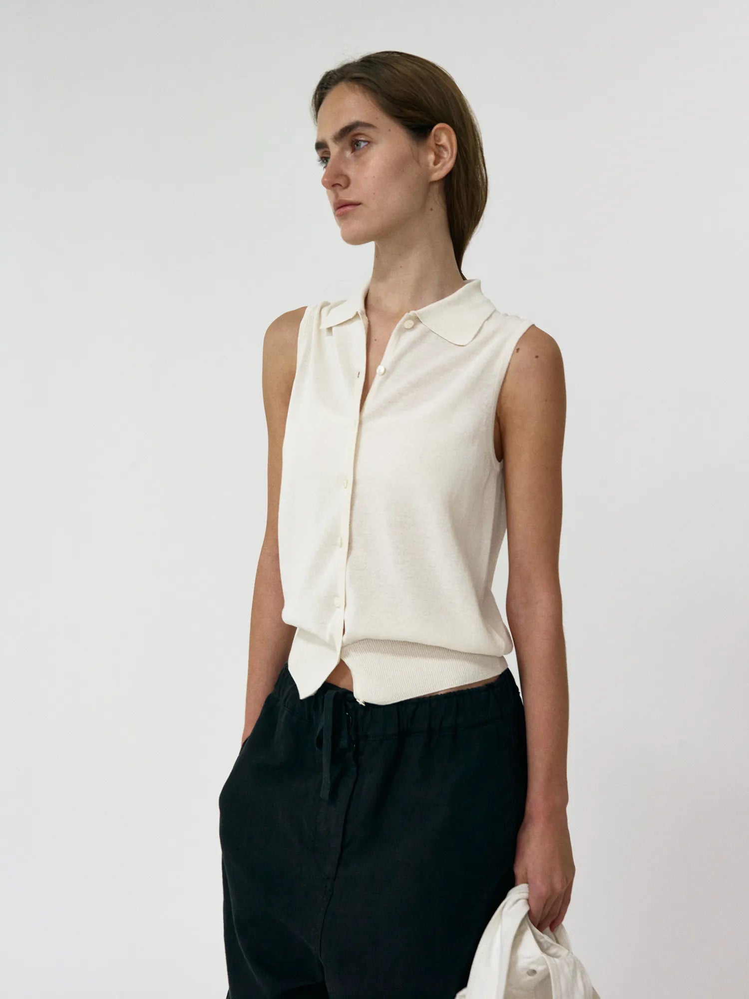 Model wearing NOTHING WRITTEN Lash Sleeveless Knit Top in Ivory