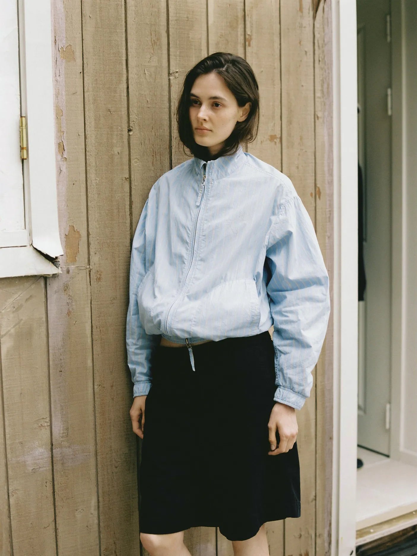 Model wearing NOTHING WRITTEN Panny Harrington Jacket in Blue Stripe