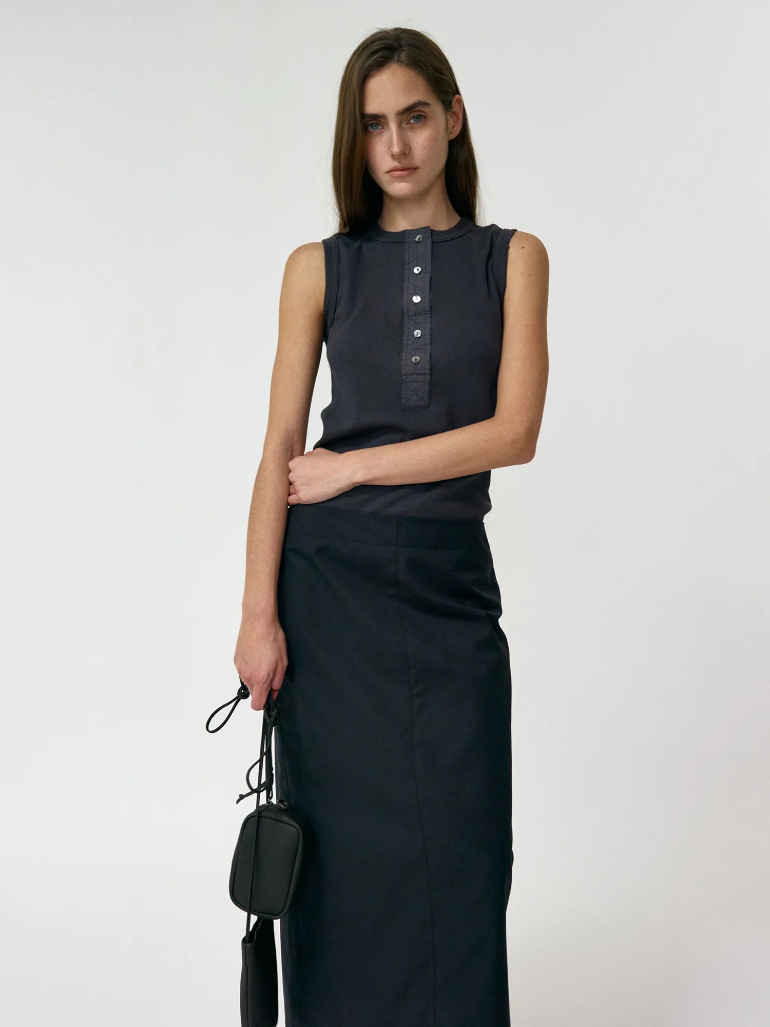 Model wearing NOTHING WRITTEN Tina Henley Neck Sleeveless in Washed Black