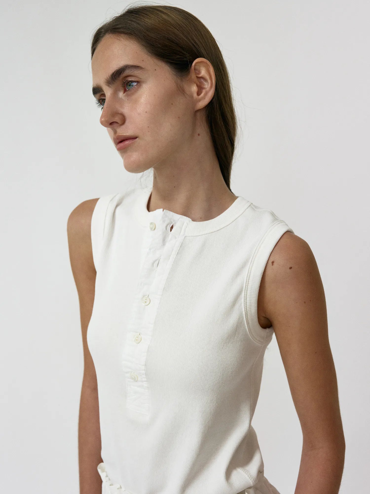 Model wearing NOTHING WRITTEN Tina Henley Neck Sleeveless in Washed White