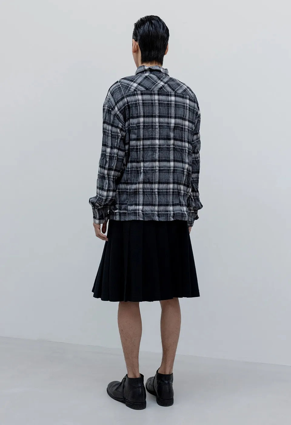 Back view of OPENYY Checkered Crinkle Ruffle Shirt in Black worn