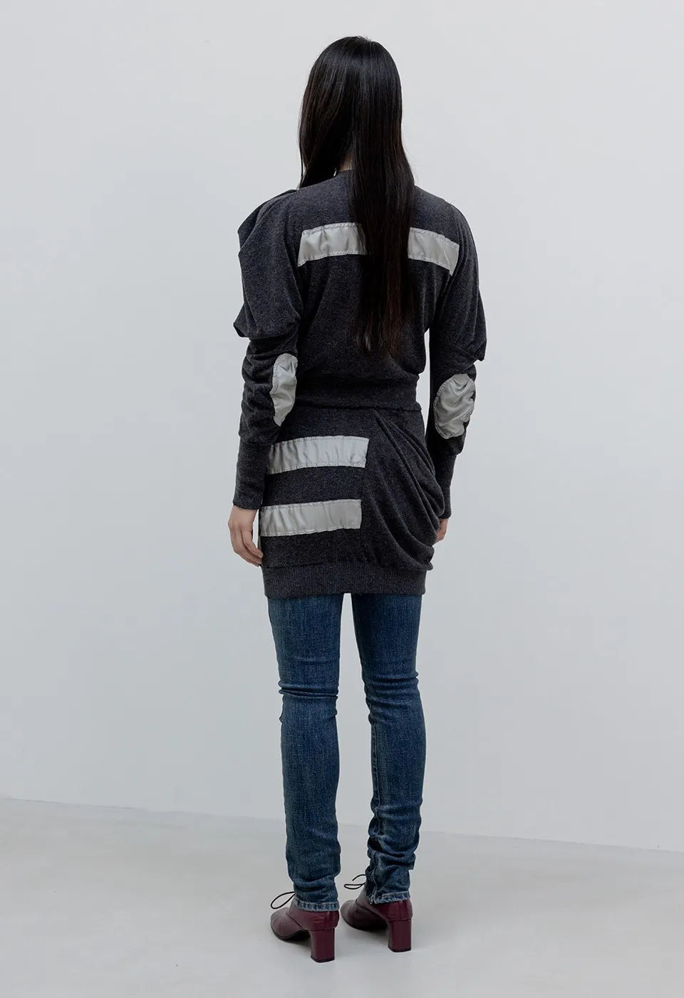 Back view of OPENYY Knitted Slouchy Panel Skirt in Charcoal worn