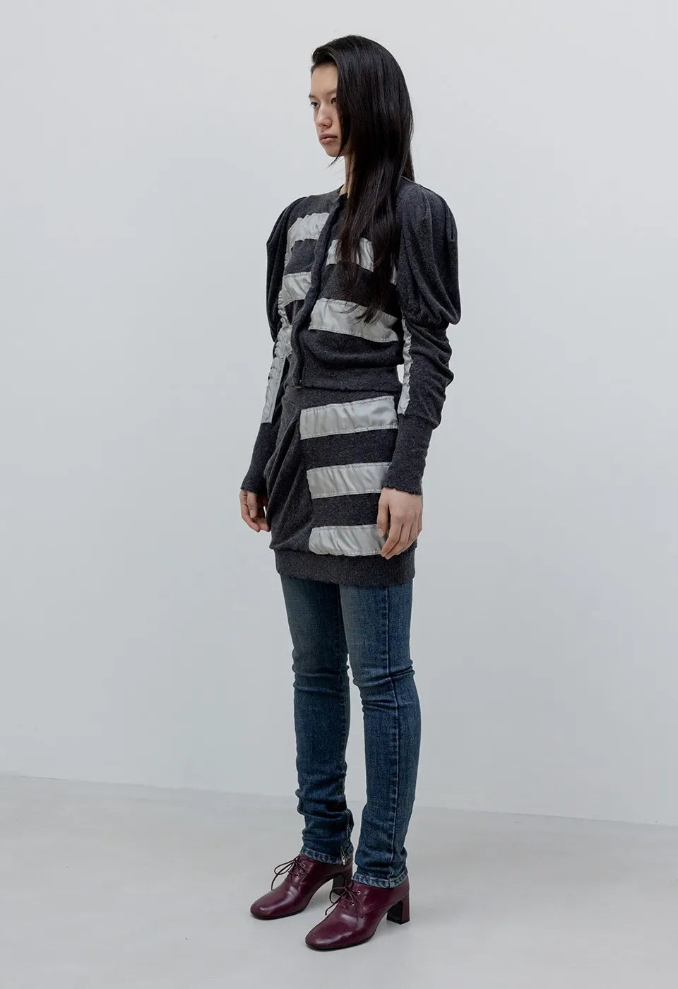 Side view of OPENYY Knitted Slouchy Panel Skirt in Charcoal worn