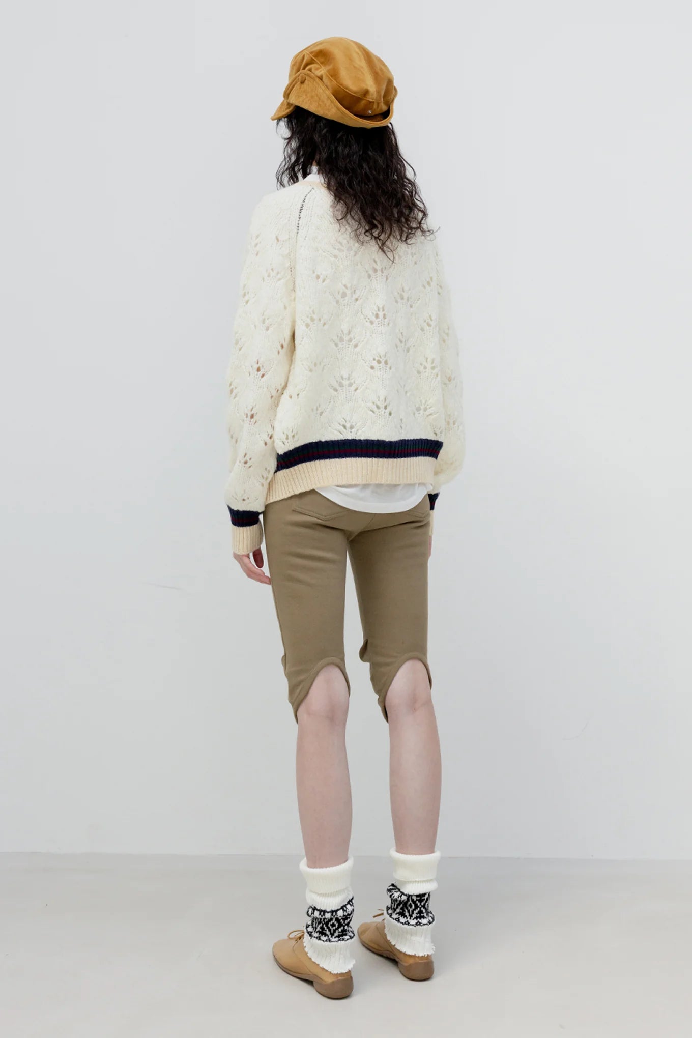 Back view of OPENYY Round Cut Capri Shorts in Khaki Green worn