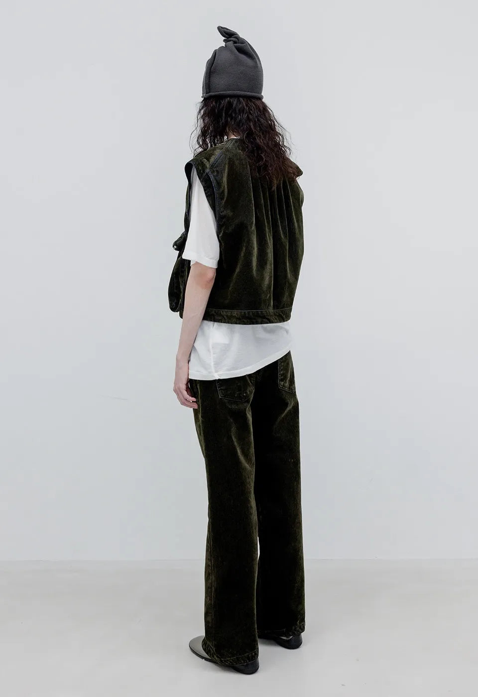 Back view of OPENYY Velvet Denim Curved Jean in Dark Olive worn