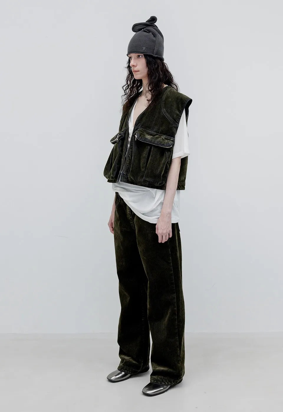 Side view of OPENYY Velvet Denim Curved Jean in Dark Olive worn
