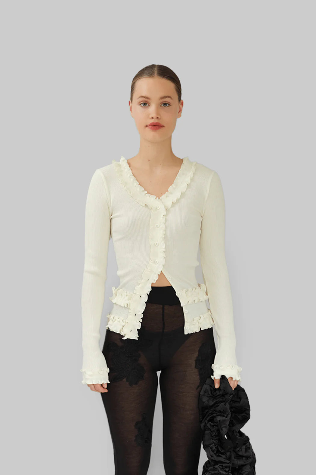Model wearing OperaSPORT Caroline Seamless Cardigan White close-up
