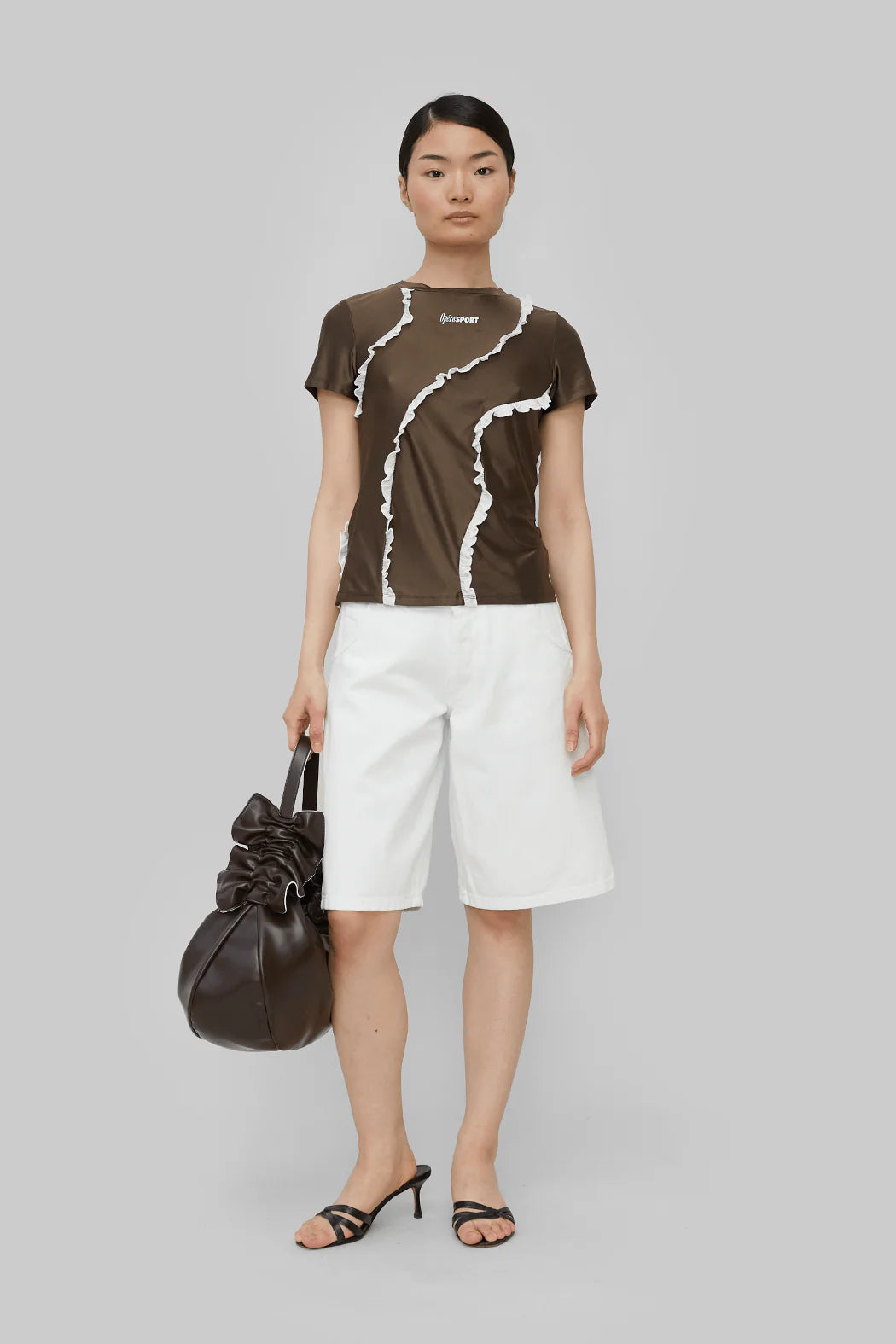 Full body look of model wearing OpéraSPORT Coleen Top in Brown