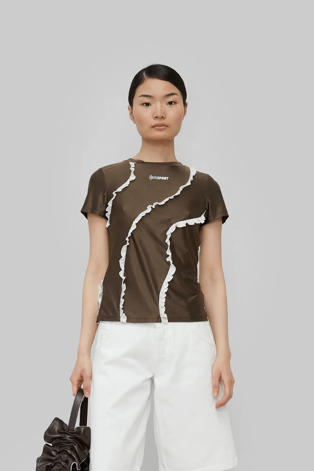Model wearing OpéraSPORT Coleen Top in Brown front view