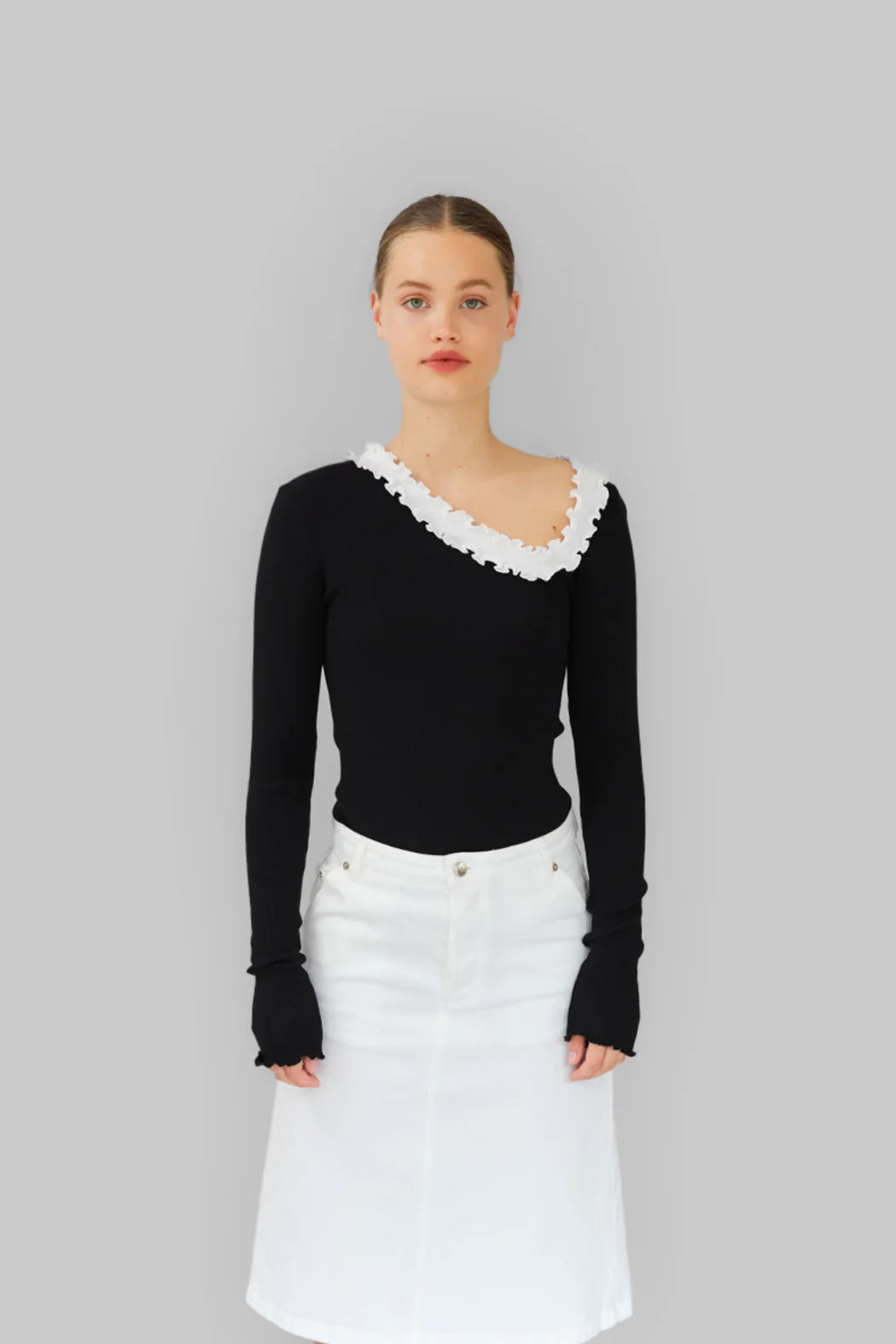 Model wearing OperaSPORT Evita Seamless Top Black front view