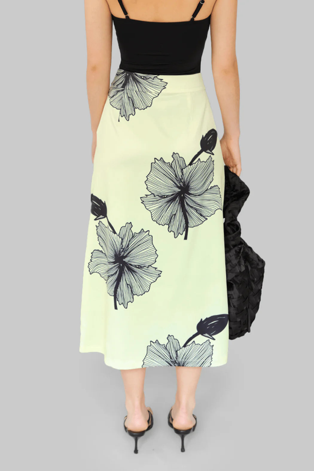 Model wearing OperaSPORT Lone Skirt Tender Yellow back view