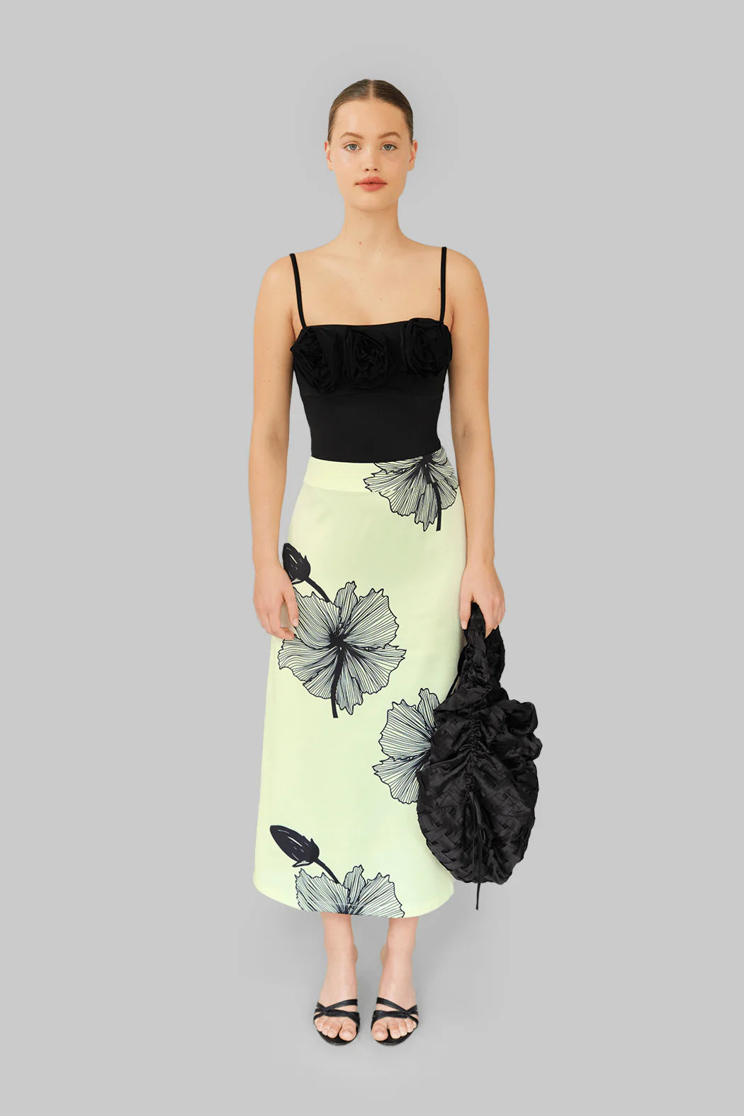 Model wearing OperaSPORT Lone Skirt Tender Yellow front view