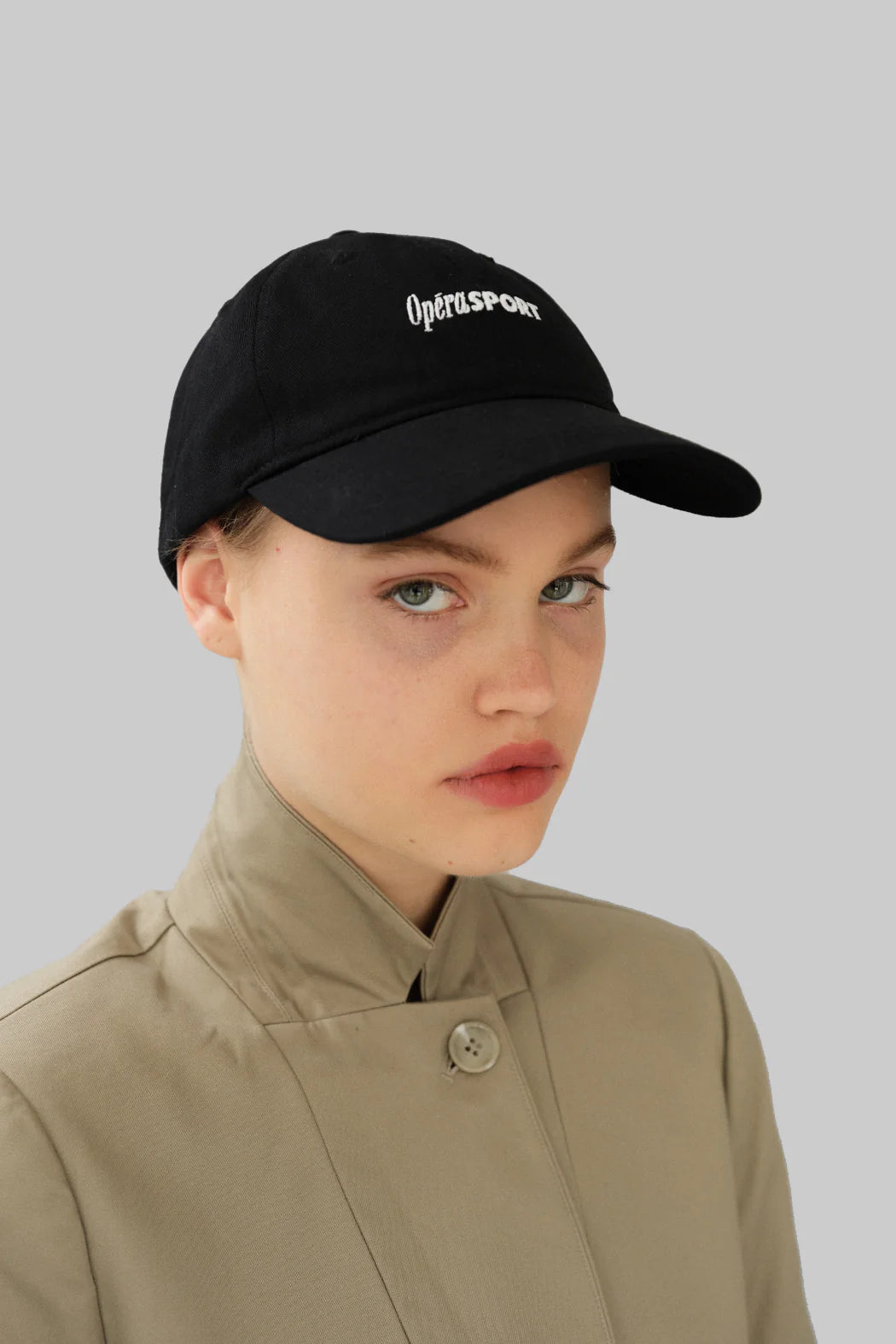 Model wearing OperaSPORT Rene Unisex Cap Black side view