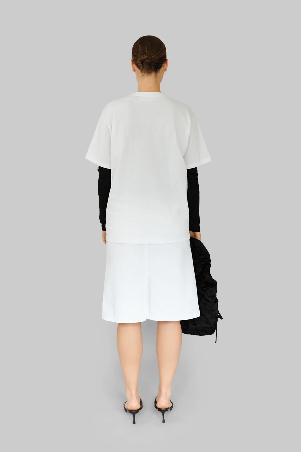 Model wearing OperaSPORT Sora T-Shirt White back view