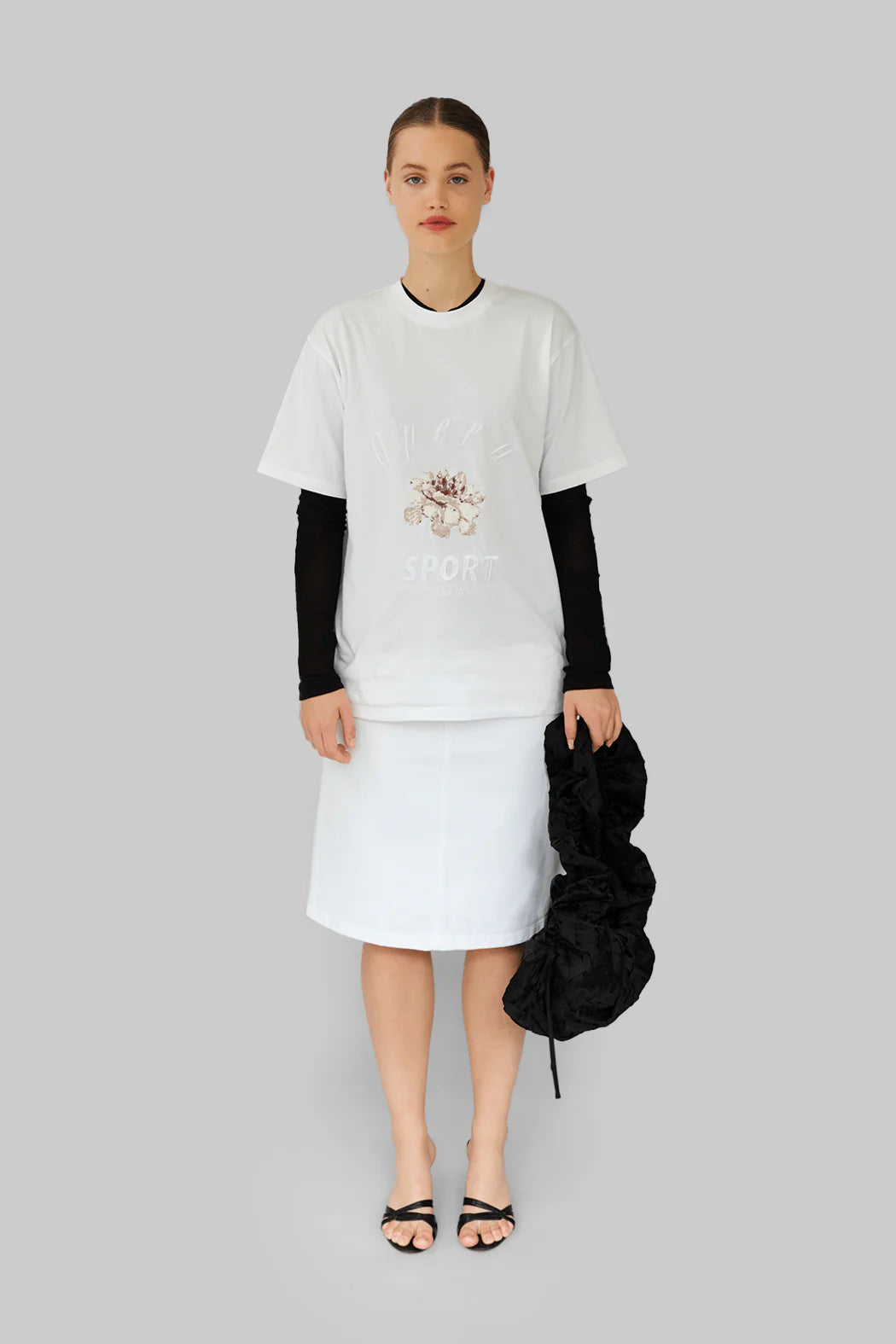 Model wearing OperaSPORT Sora T-Shirt White front view