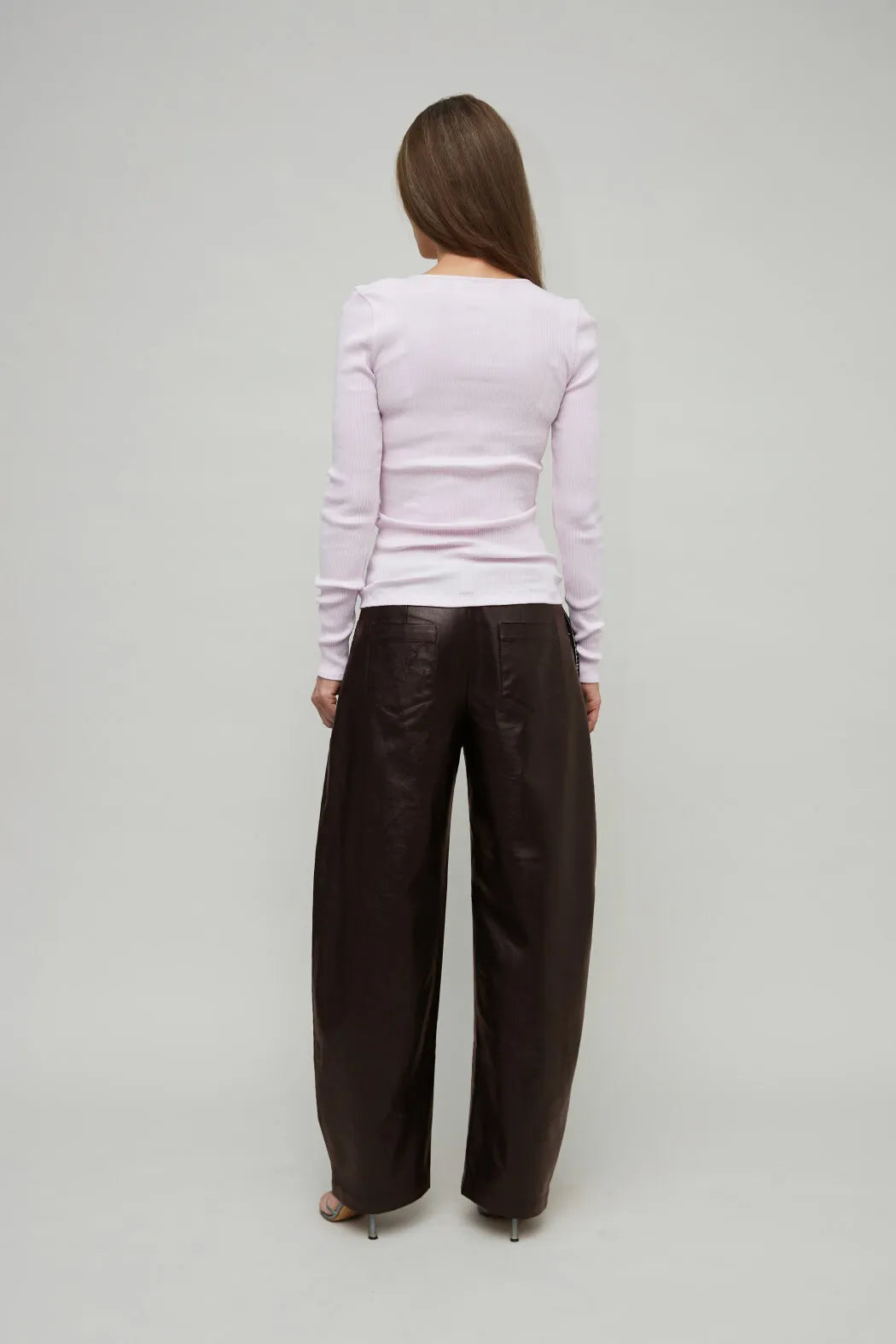 Back view of OpéraSPORT Claire Seamless Cardigan in Pink worn