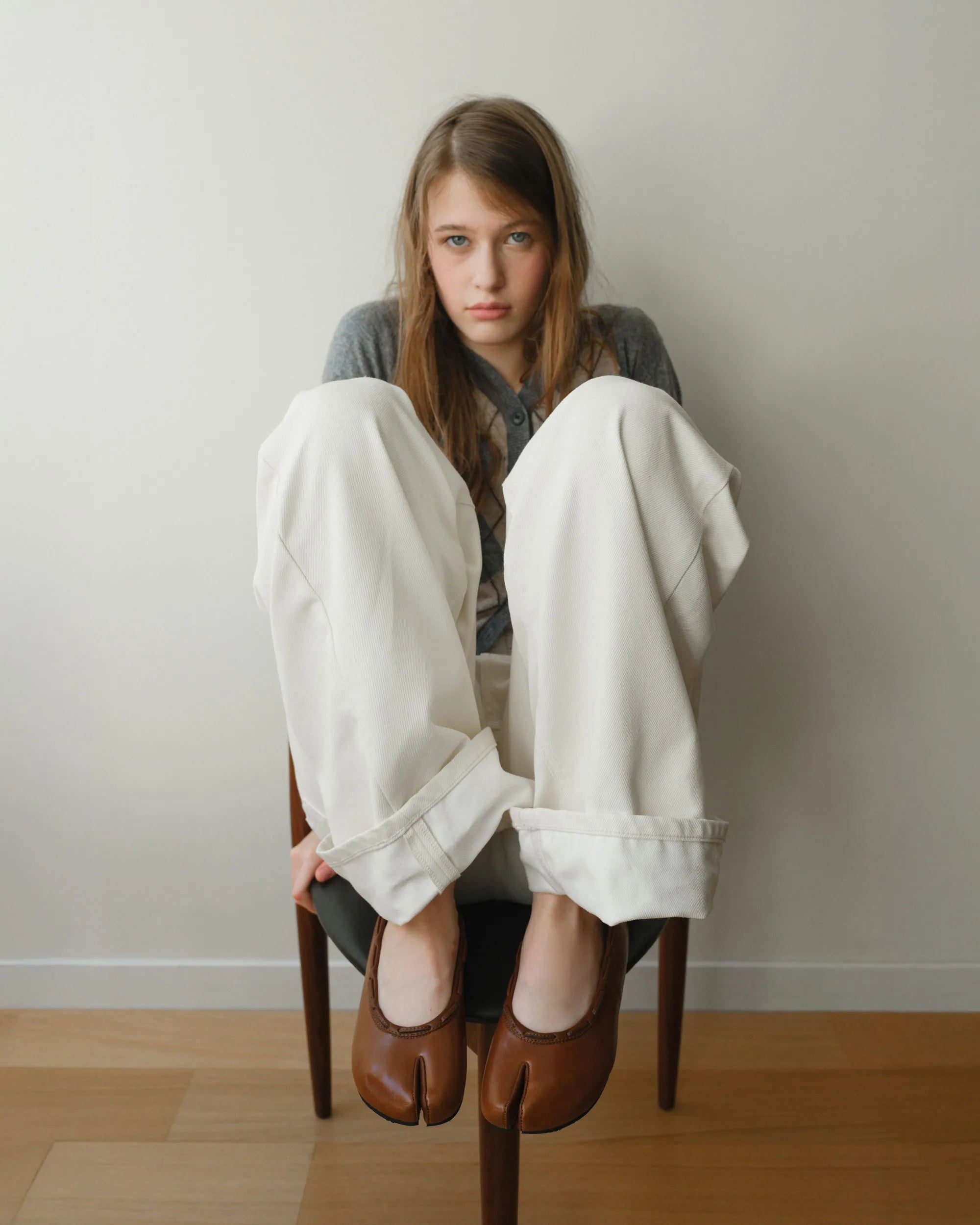 Model wearing PAES Leather String Flat in Brown