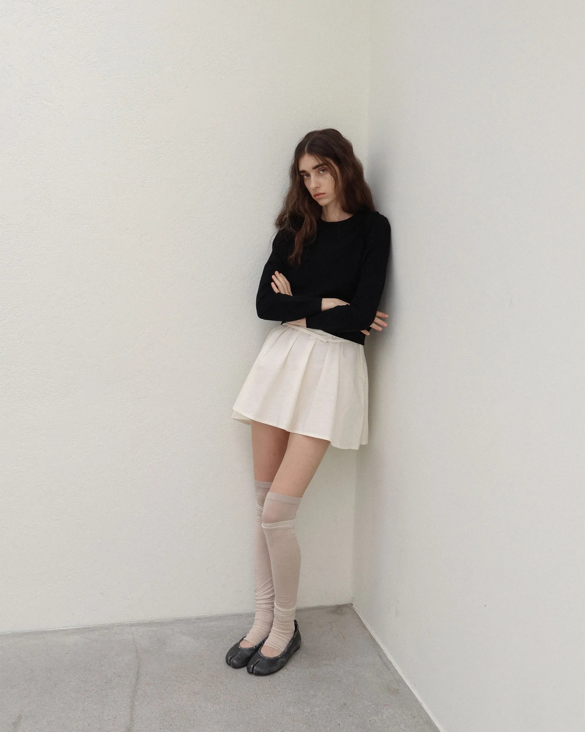 Model wearing PAES Leather String Flat in Vintage Black