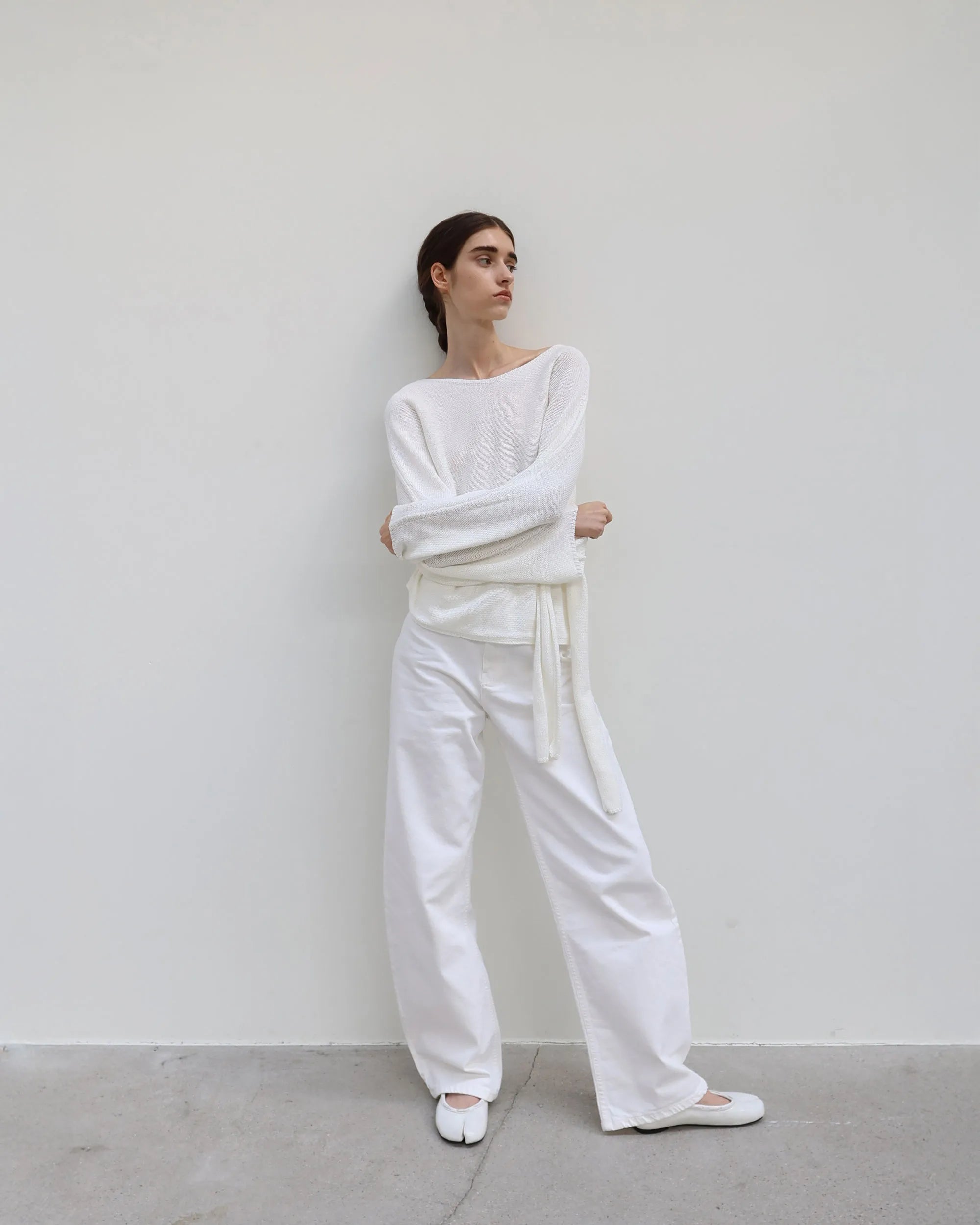 Model wearing PAES Leather String Flat in Vintage White