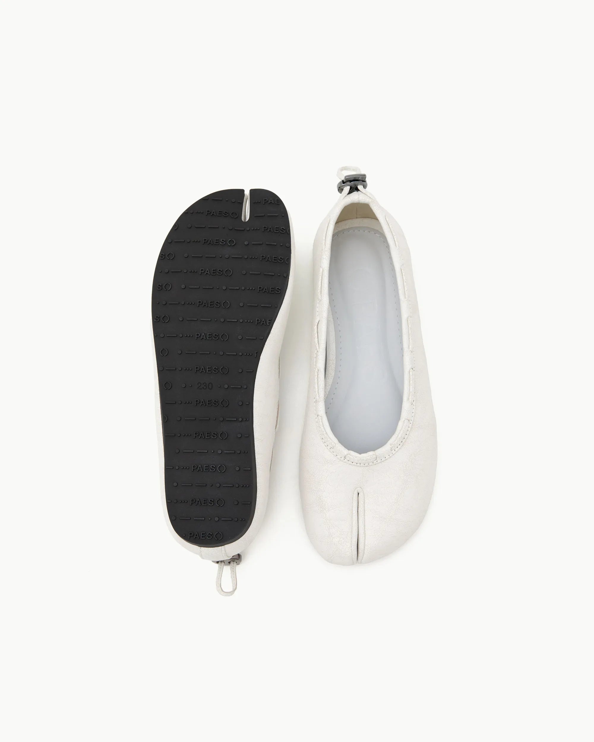 Top and outsole view of PAES Leather String Flat in Vintage White