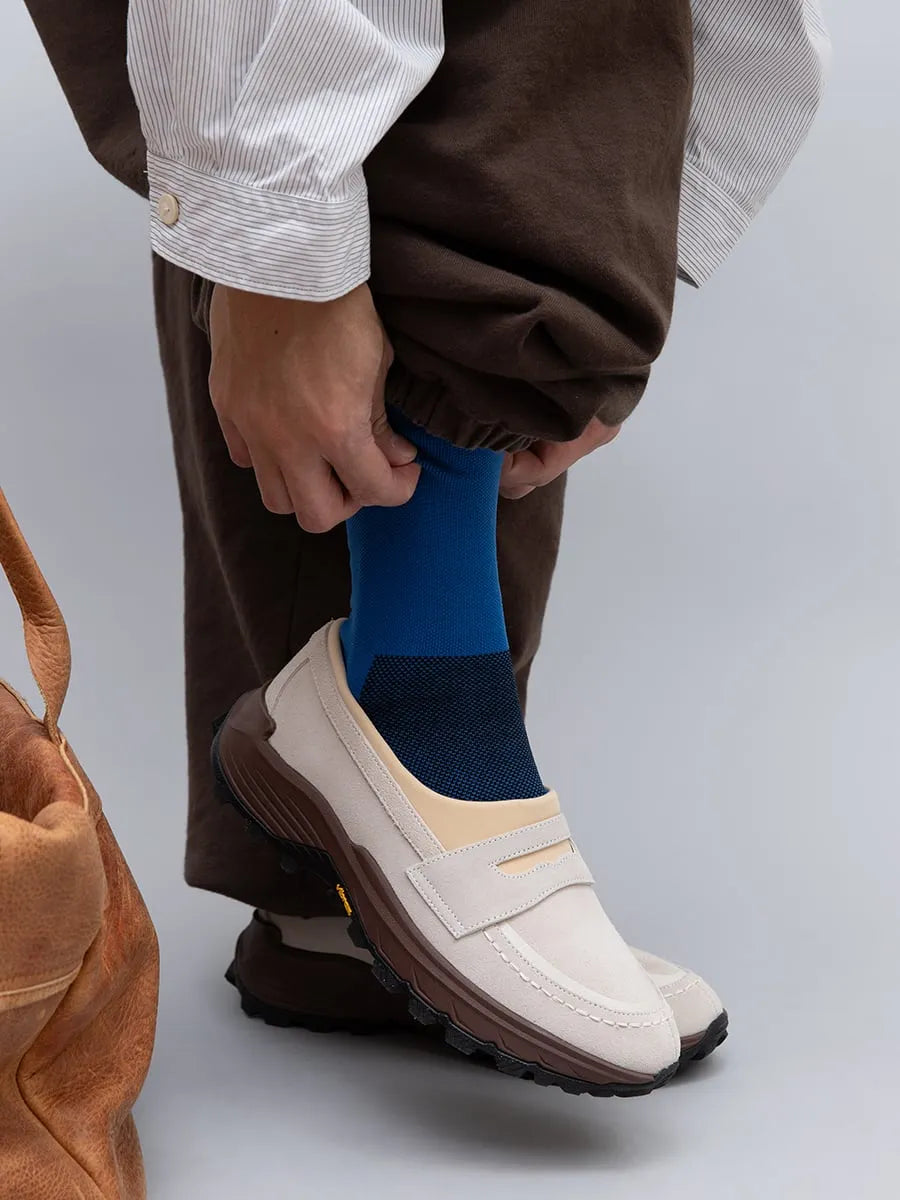 Model wearing PLAYGROUND PG DISH Off White loafers
