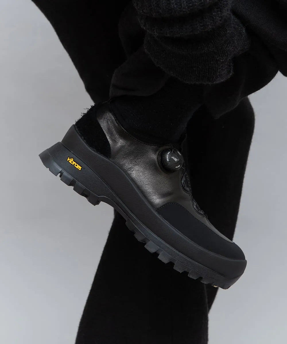 Model wearing PLAYGROUND PG Oliver Black sneakers