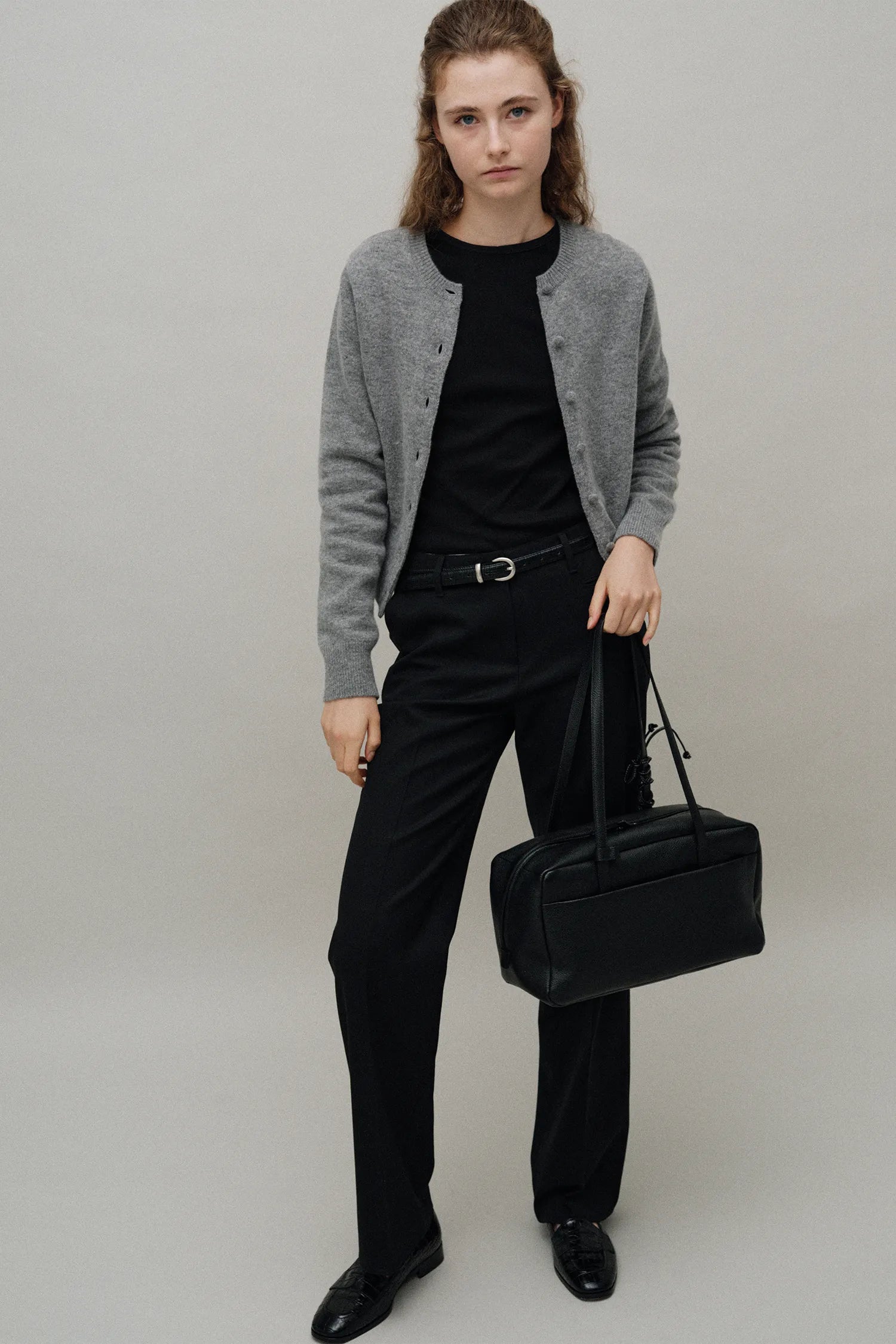 Model carrying Pocket Shoulder Bag Black front view