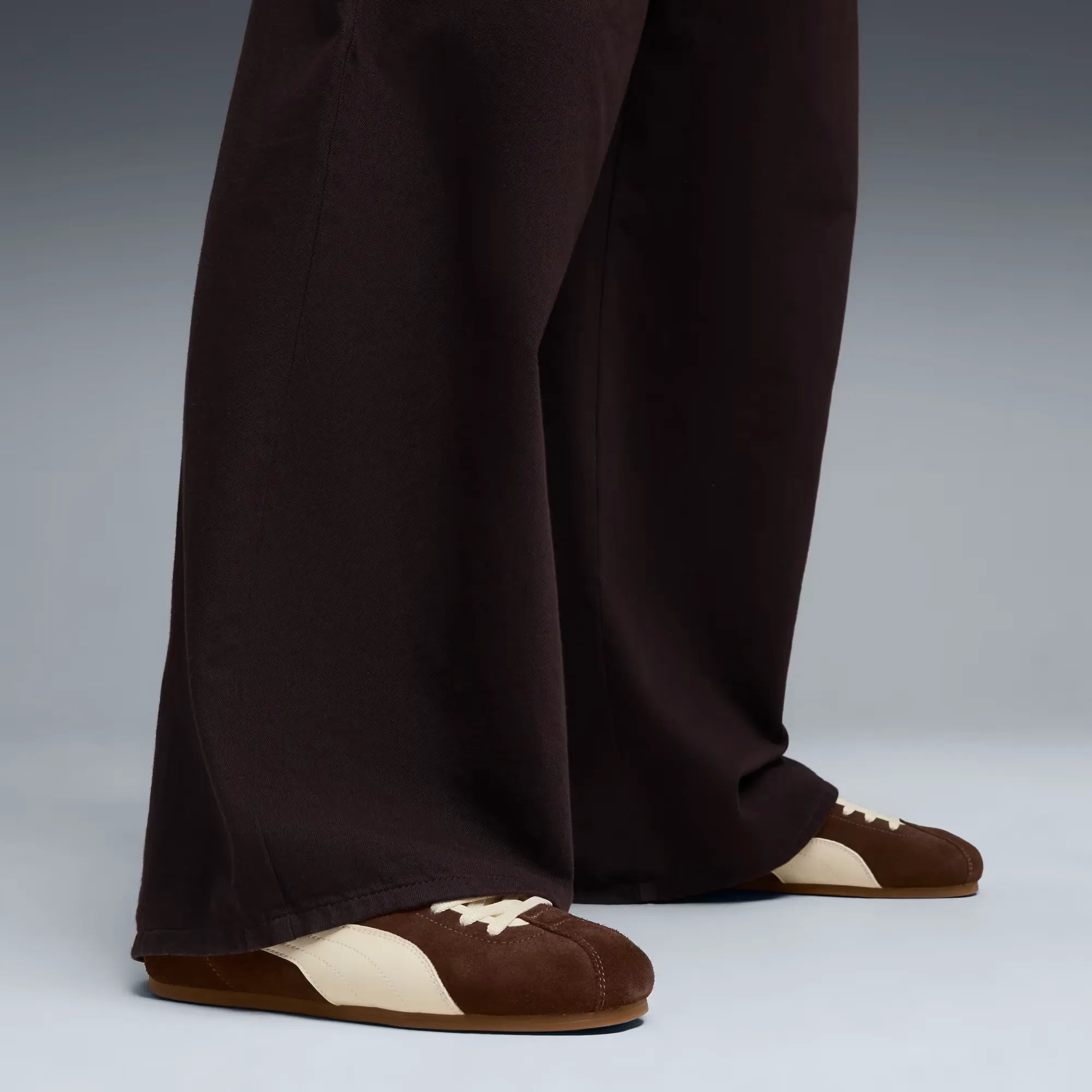 Model wearing PUMA Tackle Chocolate Alpine Snow Gum