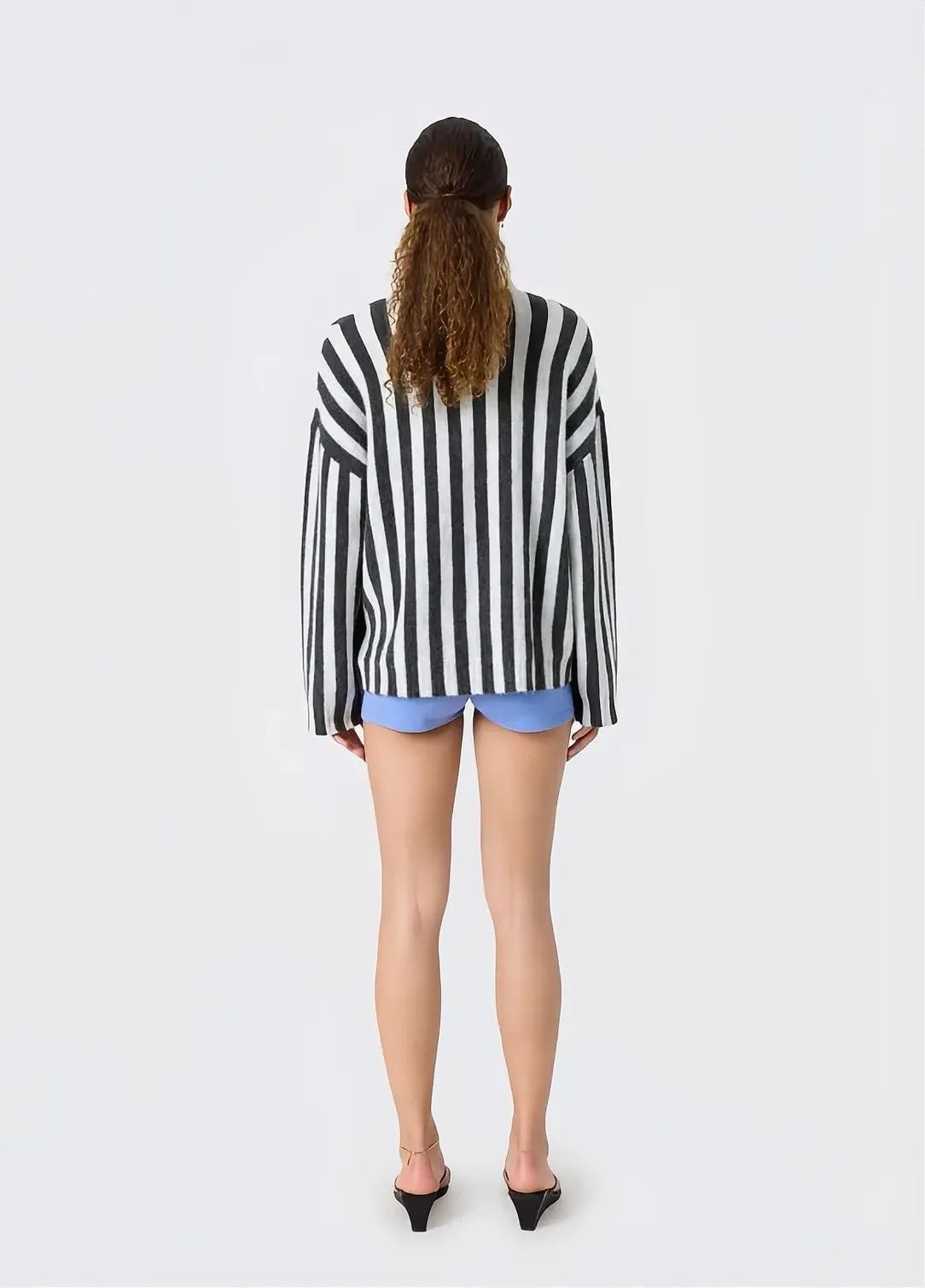 Back view of model wearing RESUME MillerRS Knit Polo Grey Stripe