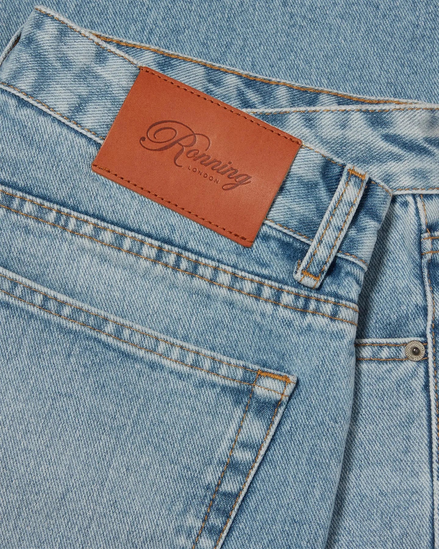 Leather patch detail of RONNING Classic Jeans in Vintage Blue