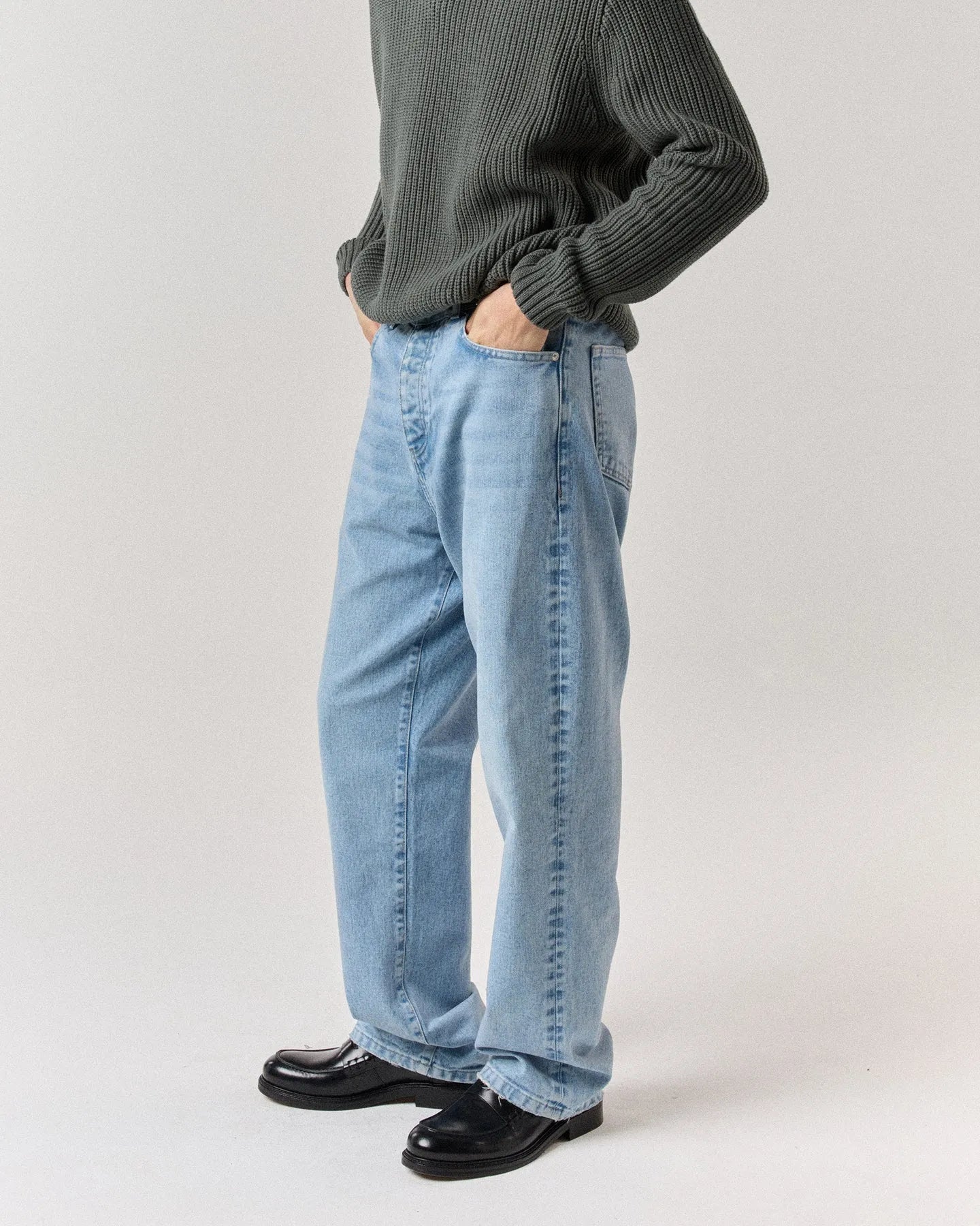 Side view of model wearing RONNING Classic Jeans in Vintage Blue