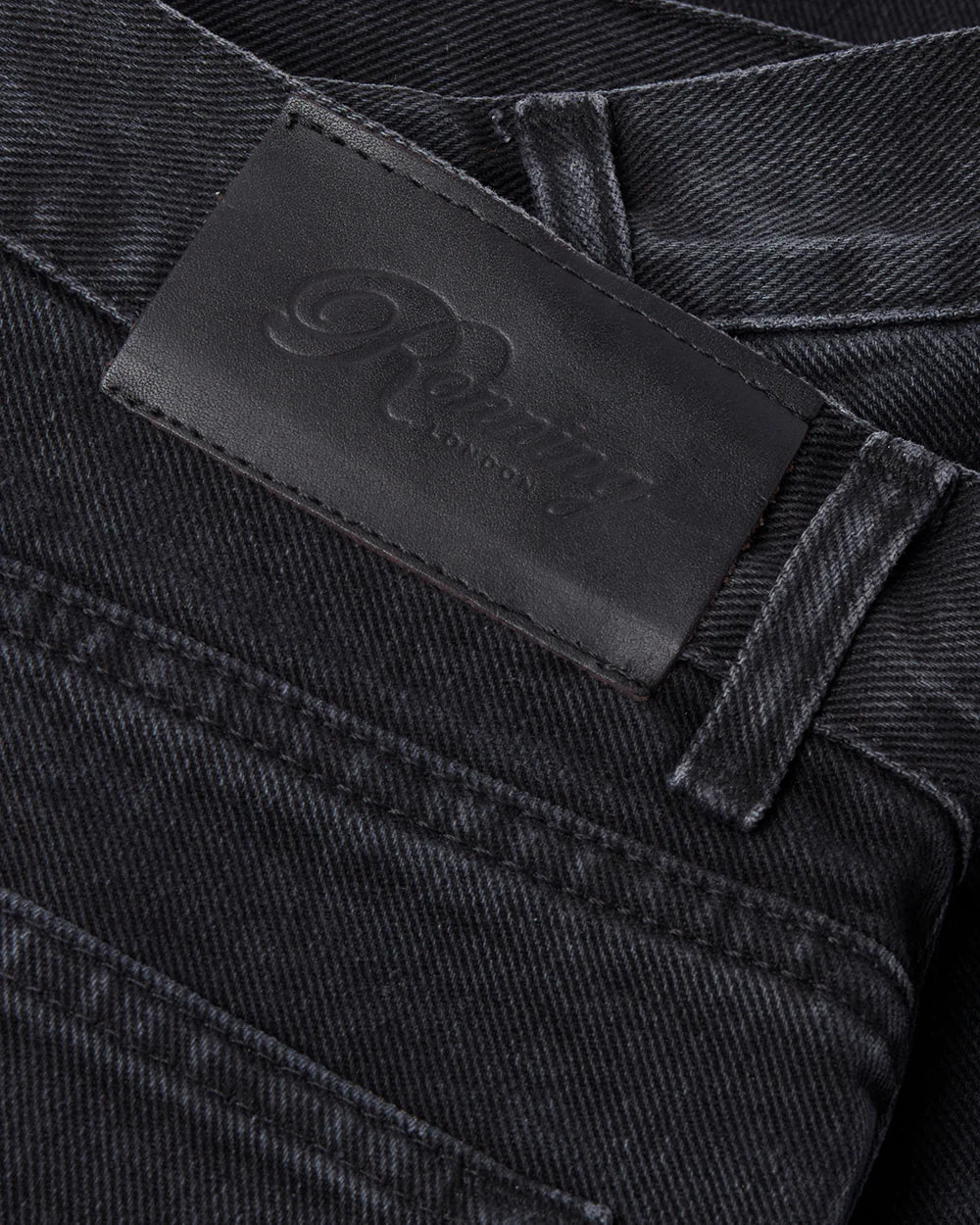 Fabric and label detail of RONNING Classic Jeans in Washed Black
