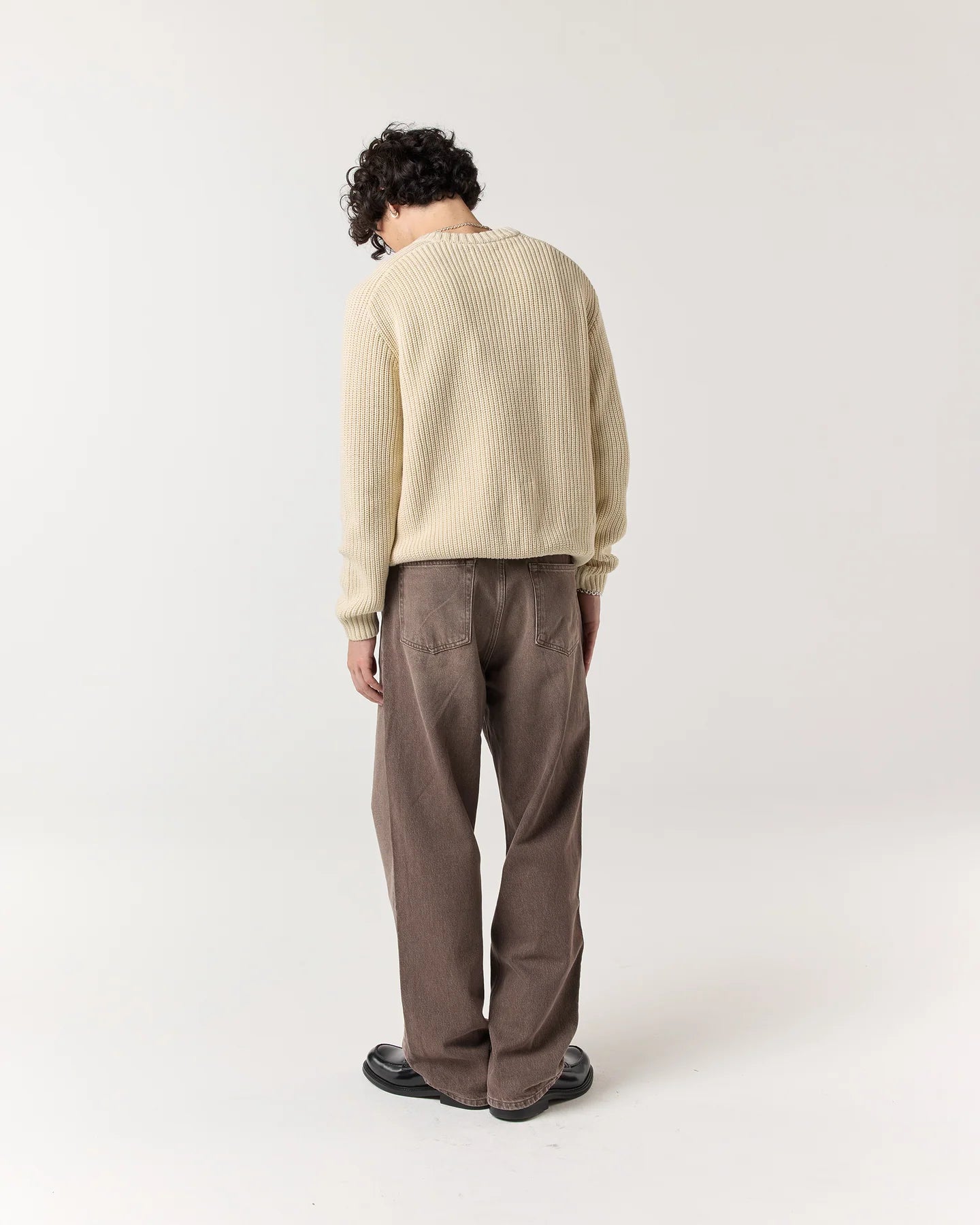 Back view of model wearing RONNING Classic Jeans in Washed Brown