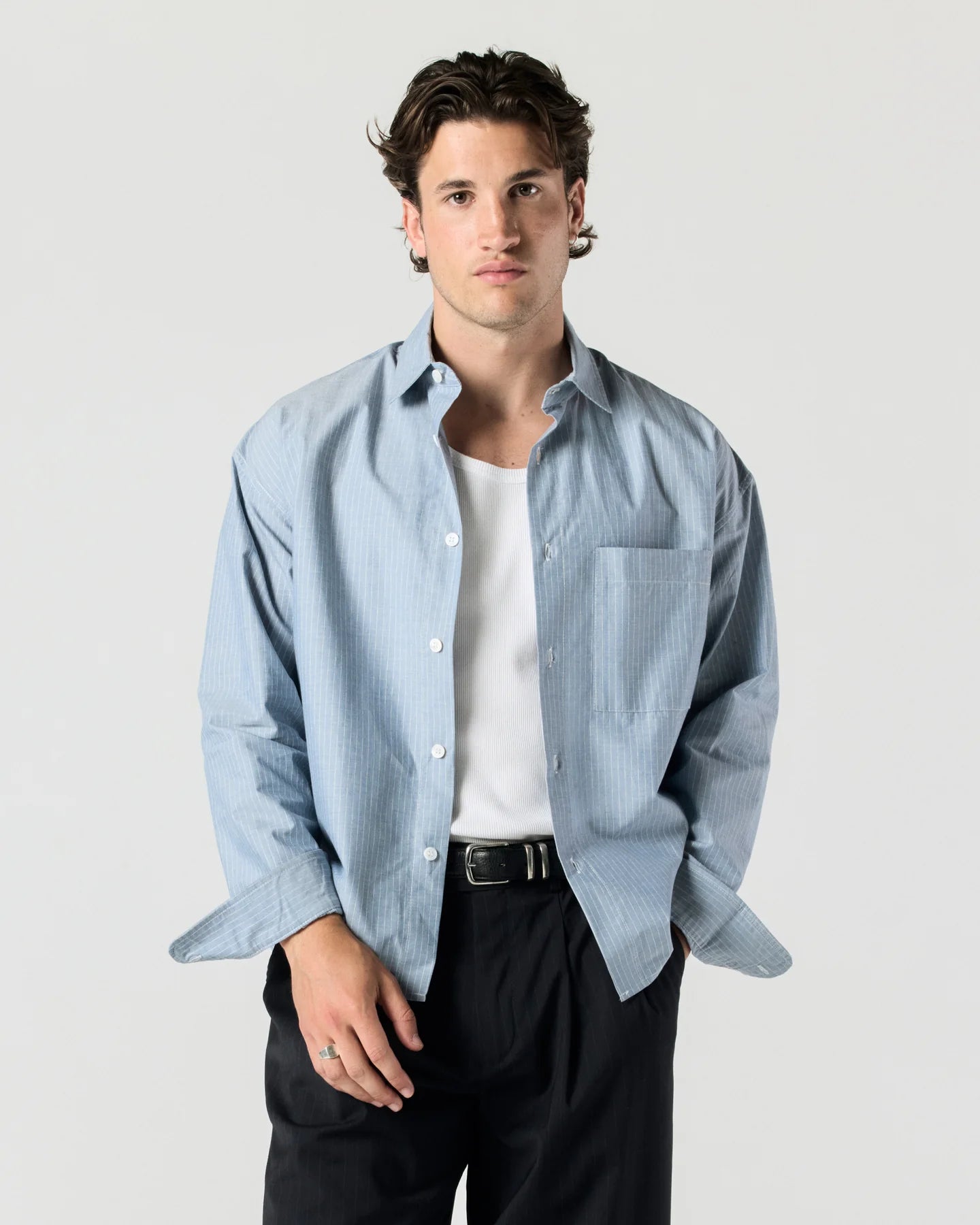 Model wearing RONNING Everyday Shirt in Blue Stripe