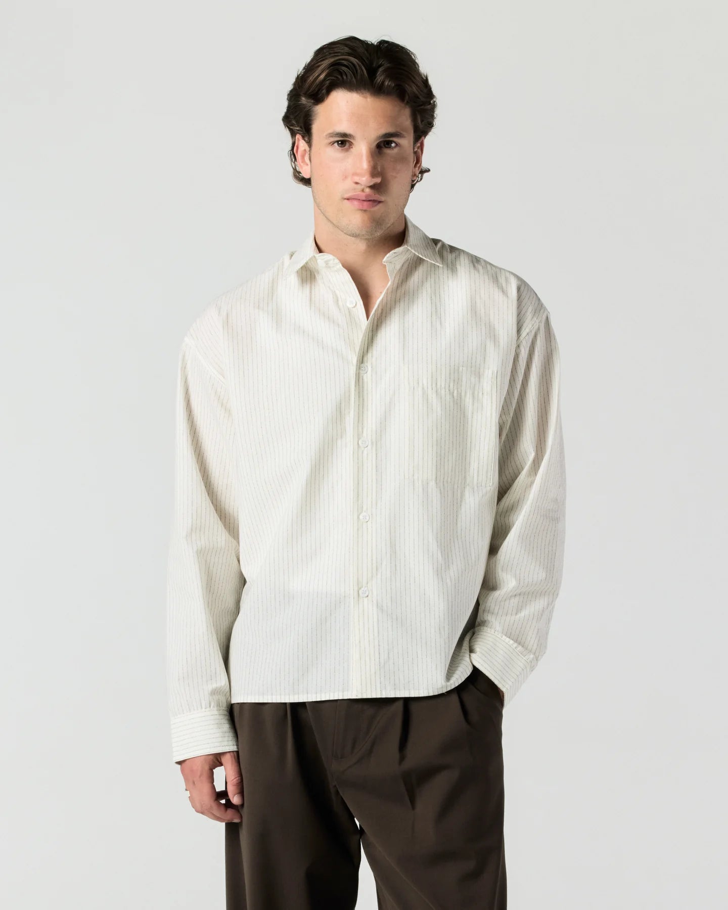 Model wearing RONNING Everyday Shirt in Cream Stripe