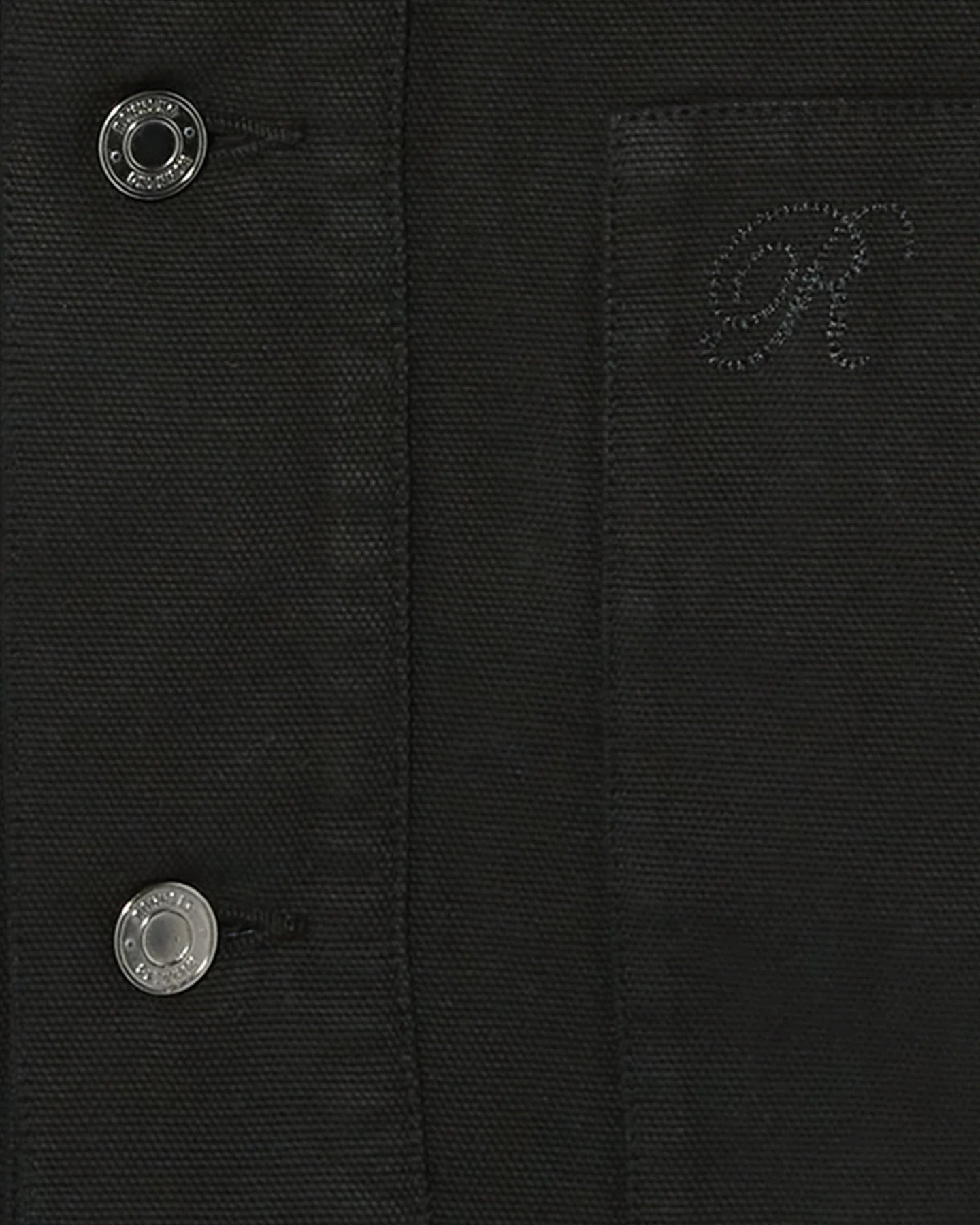 Fabric and button detail of Ronning Fatigue Jacket in Black