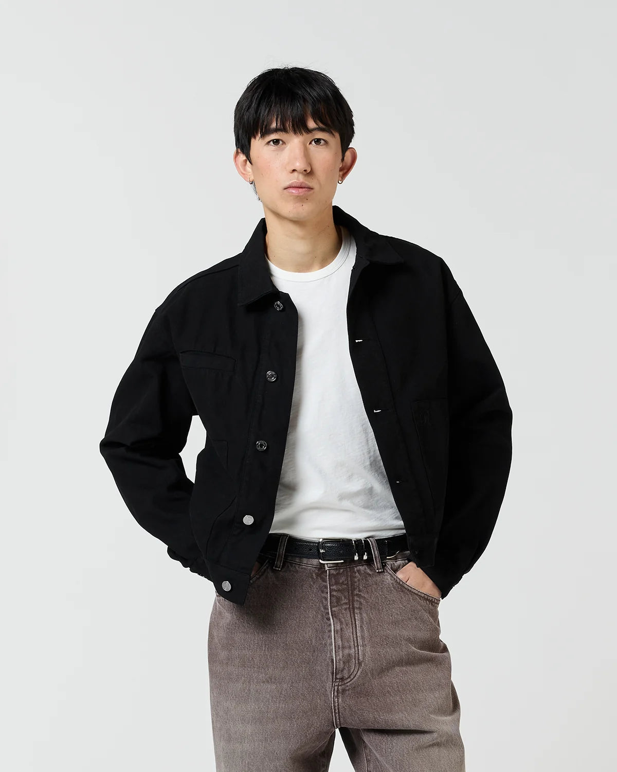Front view of model wearing Ronning Fatigue Jacket in Black