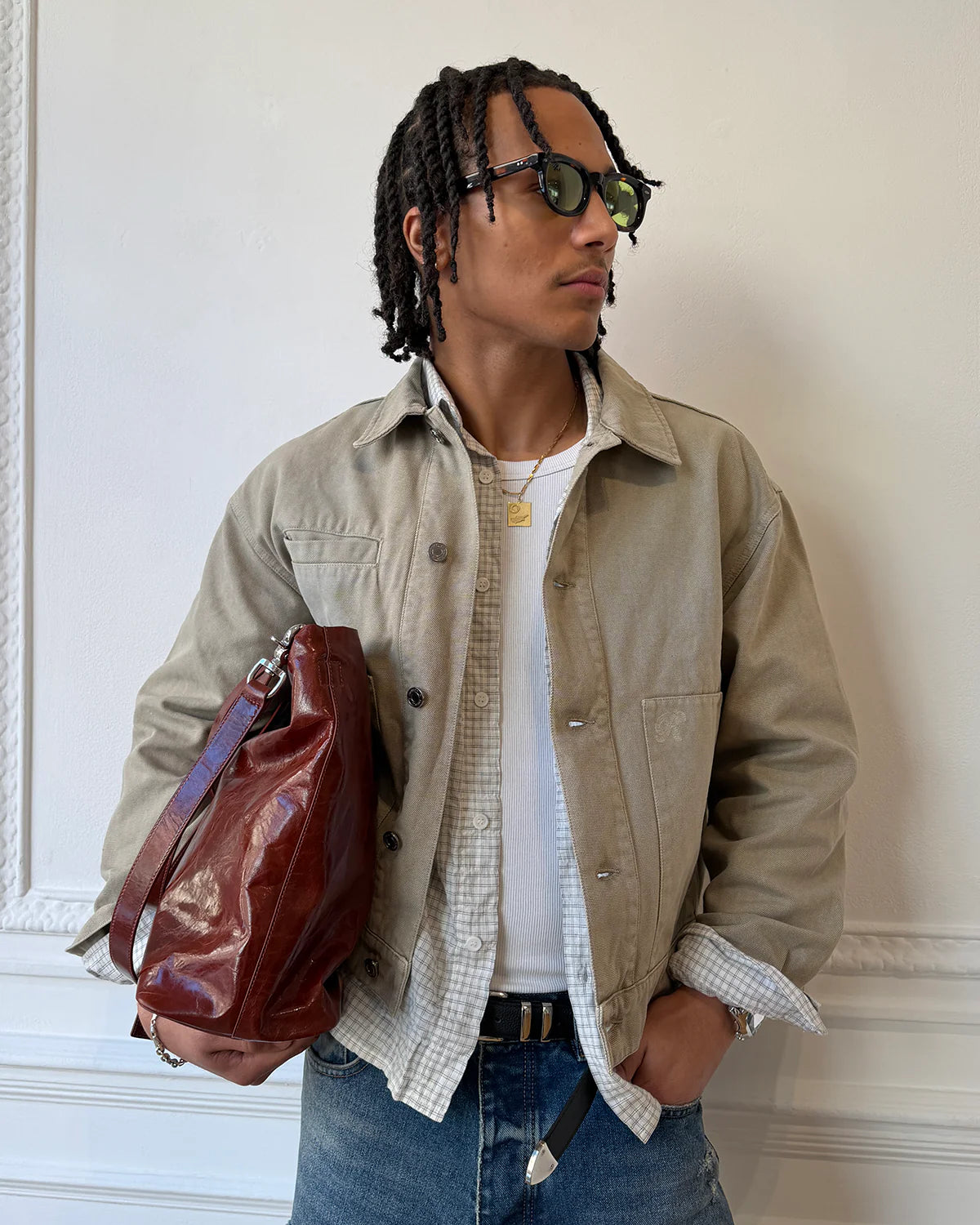Model wearing Ronning Fatigue Jacket in Sand side profile view