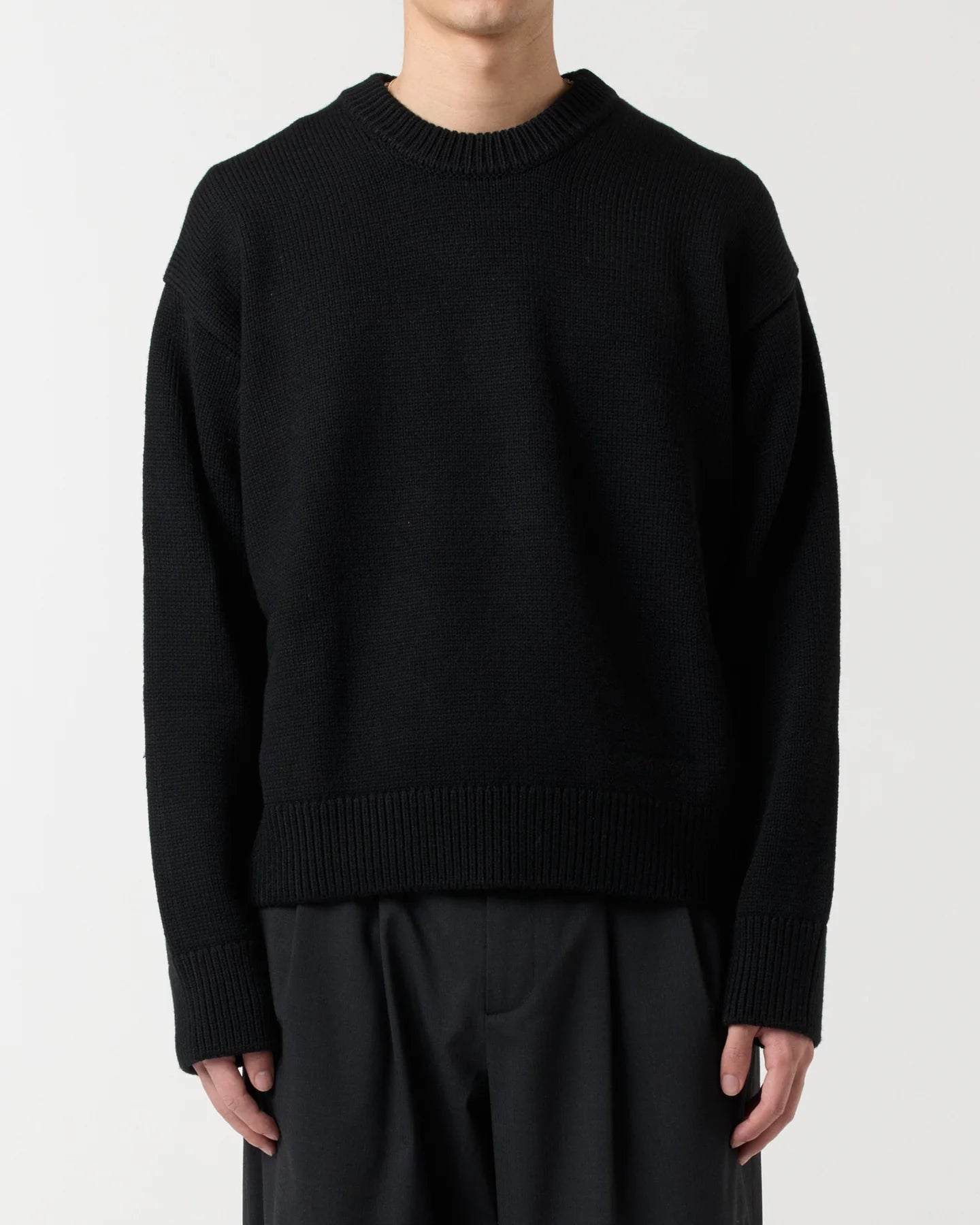 Model wearing RONNING R Knit Sweater in Black