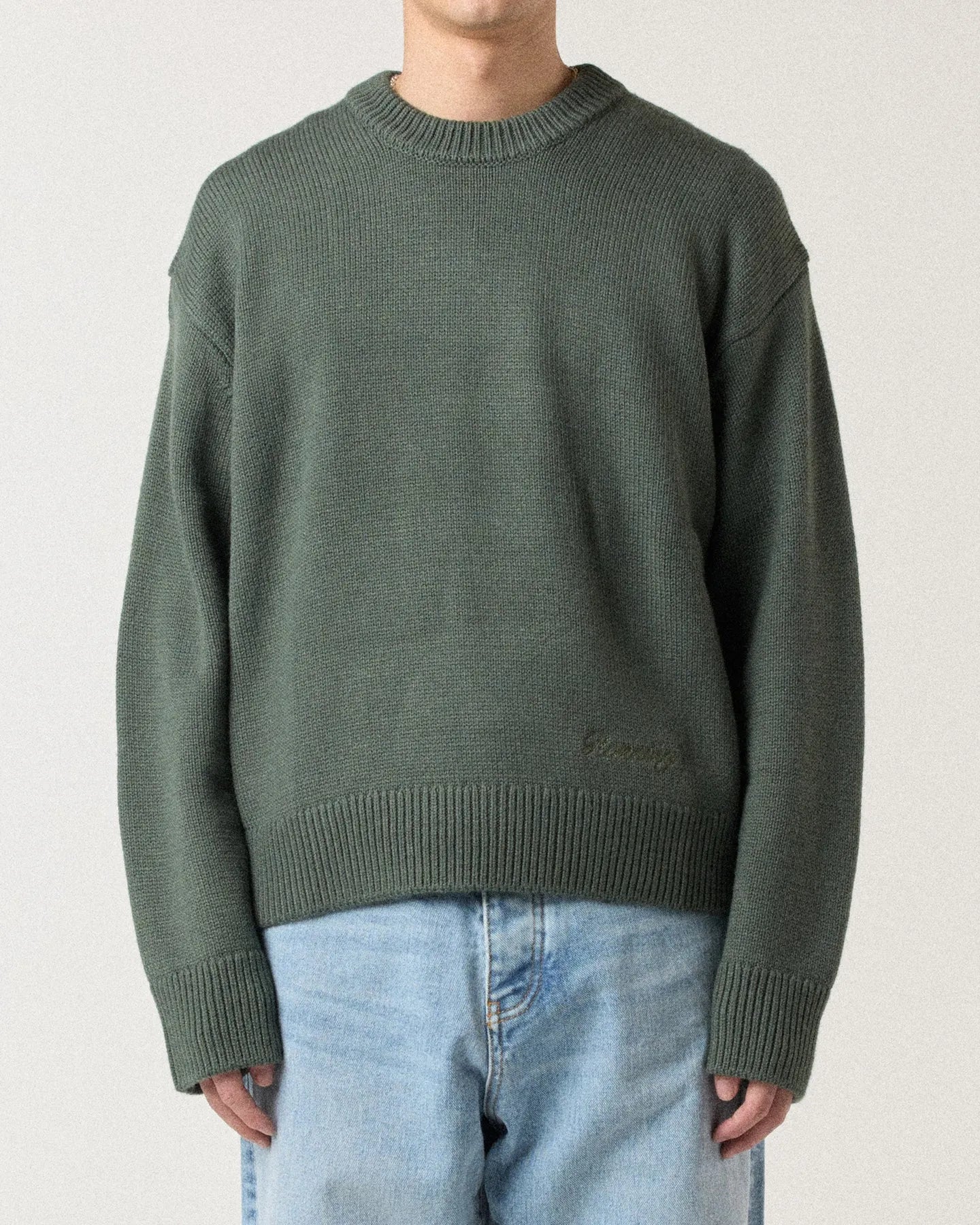 Model wearing RONNING R Knit Sweater in Green