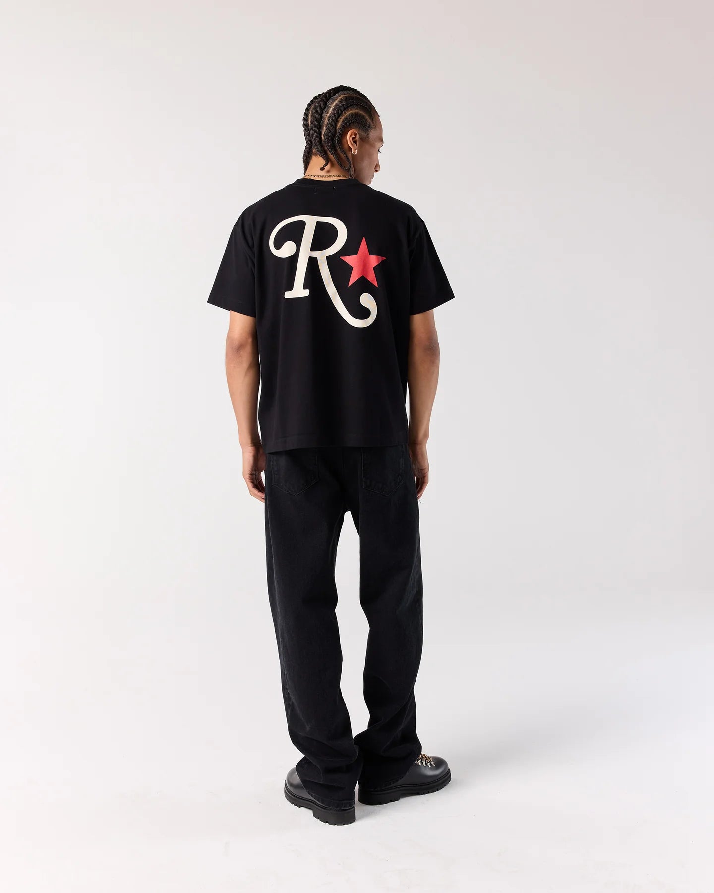 Back view of model wearing RONNING Star Tee in Black
