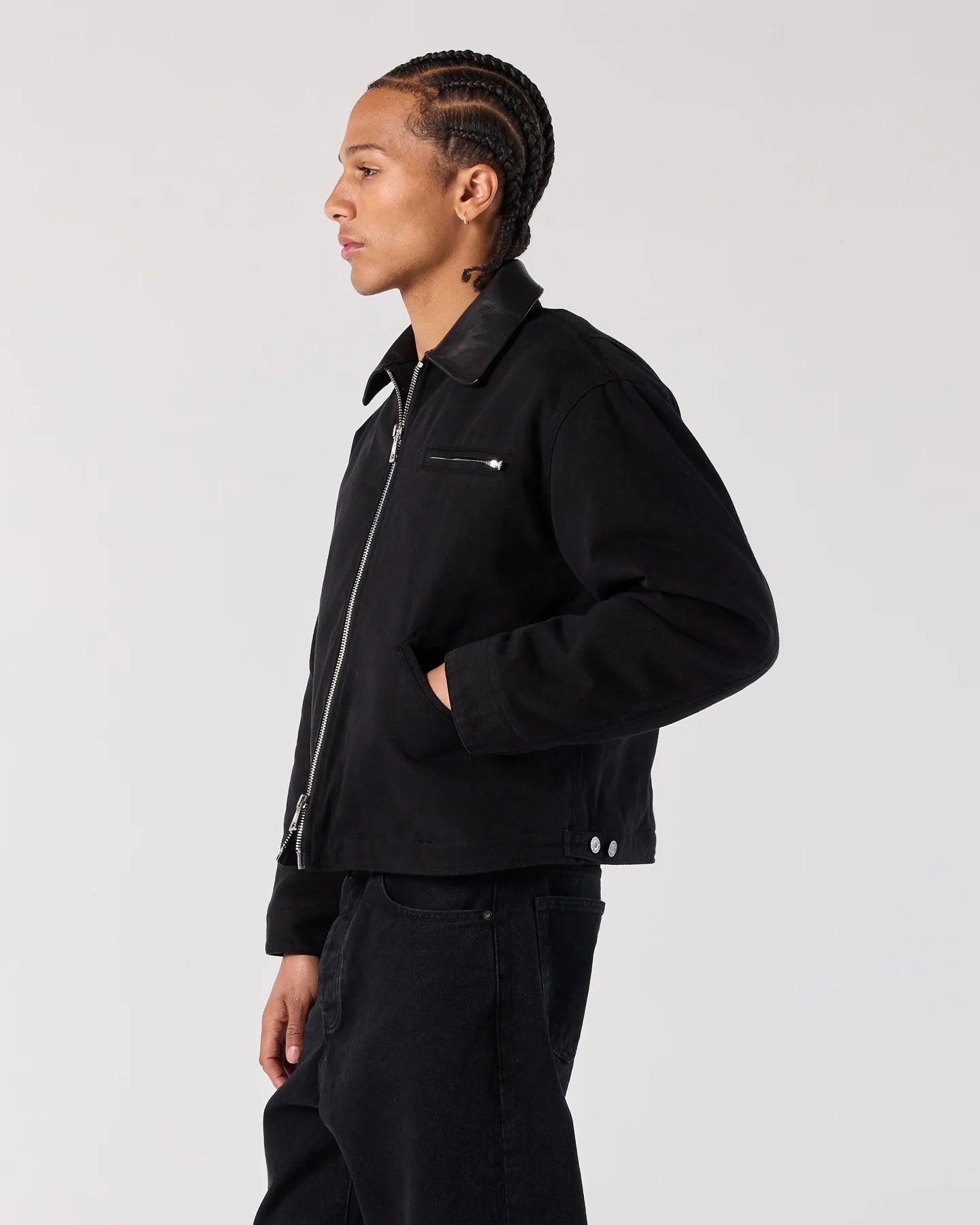 Side view of model wearing RONNING Work Jacket in Black