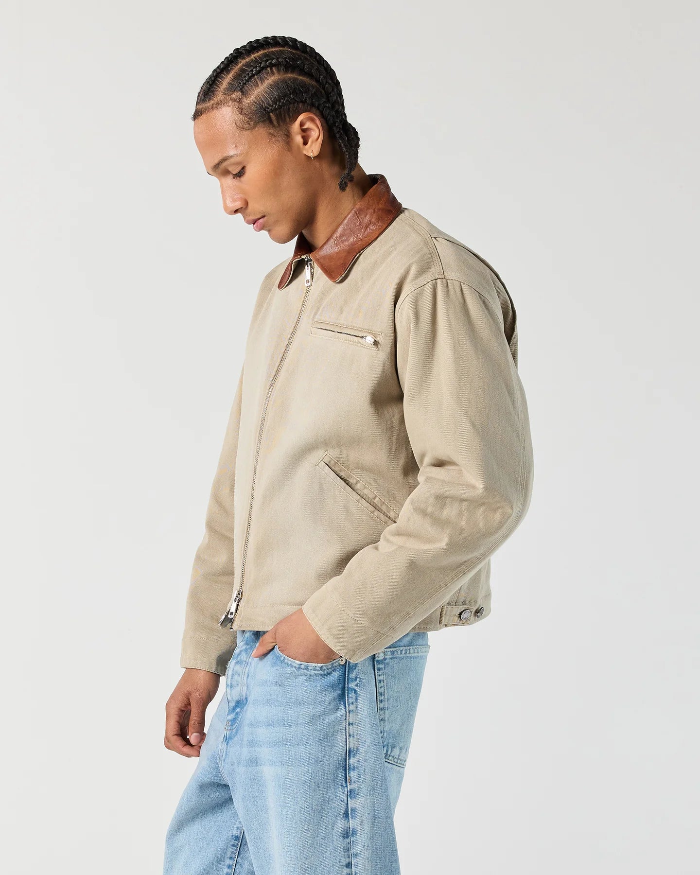Side view of model wearing RONNING Work Jacket in Washed Sand