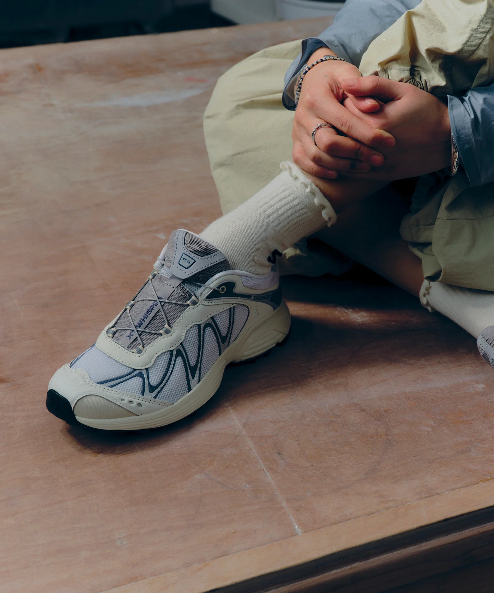 Model wearing Salomon XT-Whisper Vanilla Ice White Grisaille shoes